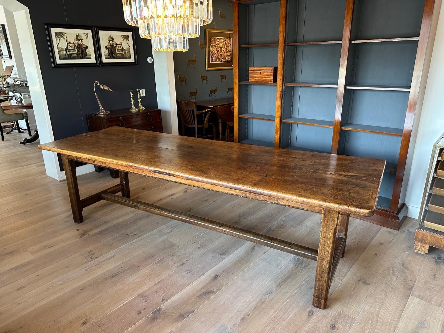 Beautiful antique 18th century French table. The table is made of a combination of wood types, which you often see with French tables. The top is made of walnut, the base is made of oak. Beautifully weathered top, consisting of 2 large parts! Table