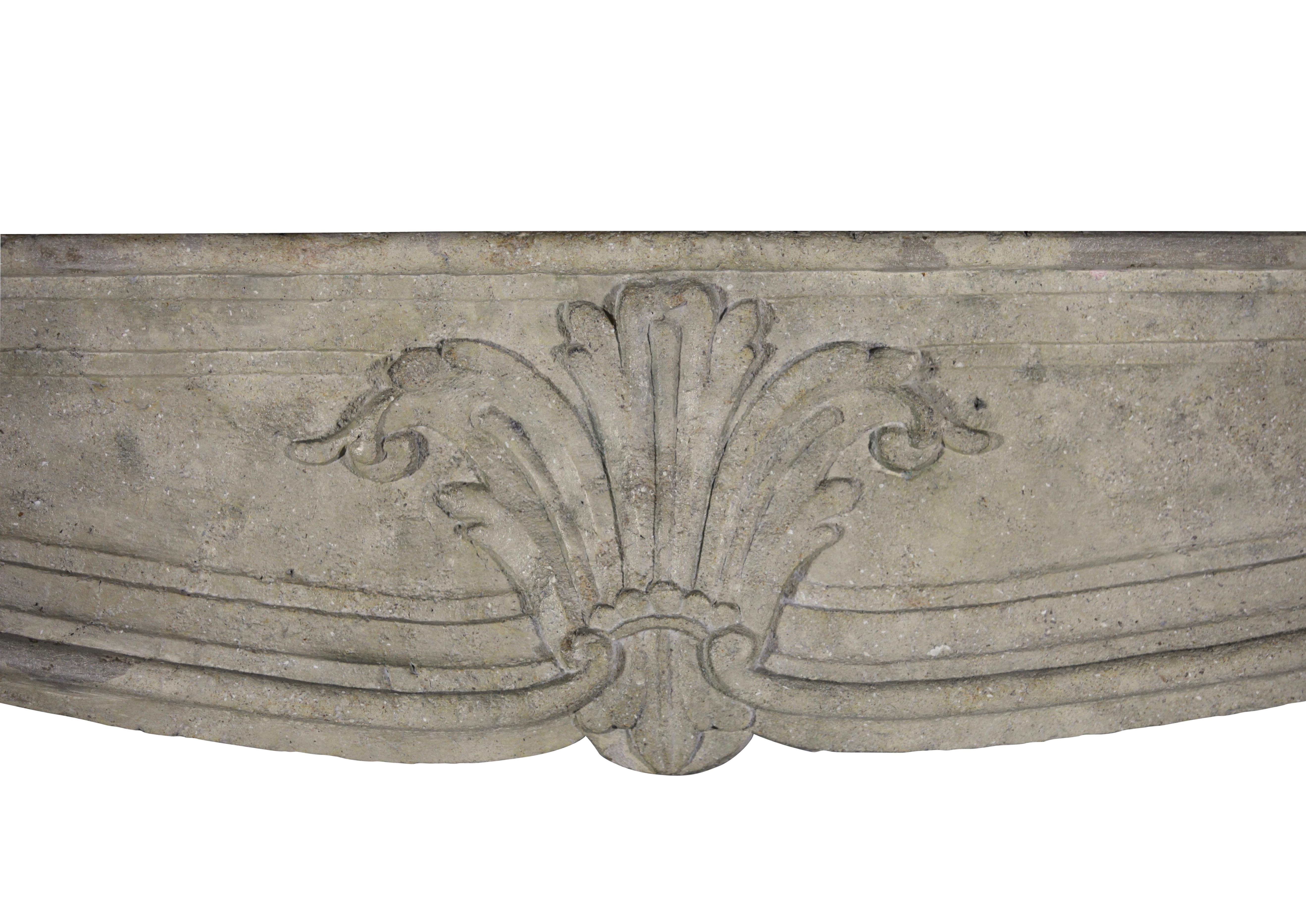 This original antique French country fireplace surround in limestone is from the Louise XIV Period. The mantle has been waxed and has a silky touch feeling the surface.
The dimensions are particular grand.
The mantle was polychromed. There is