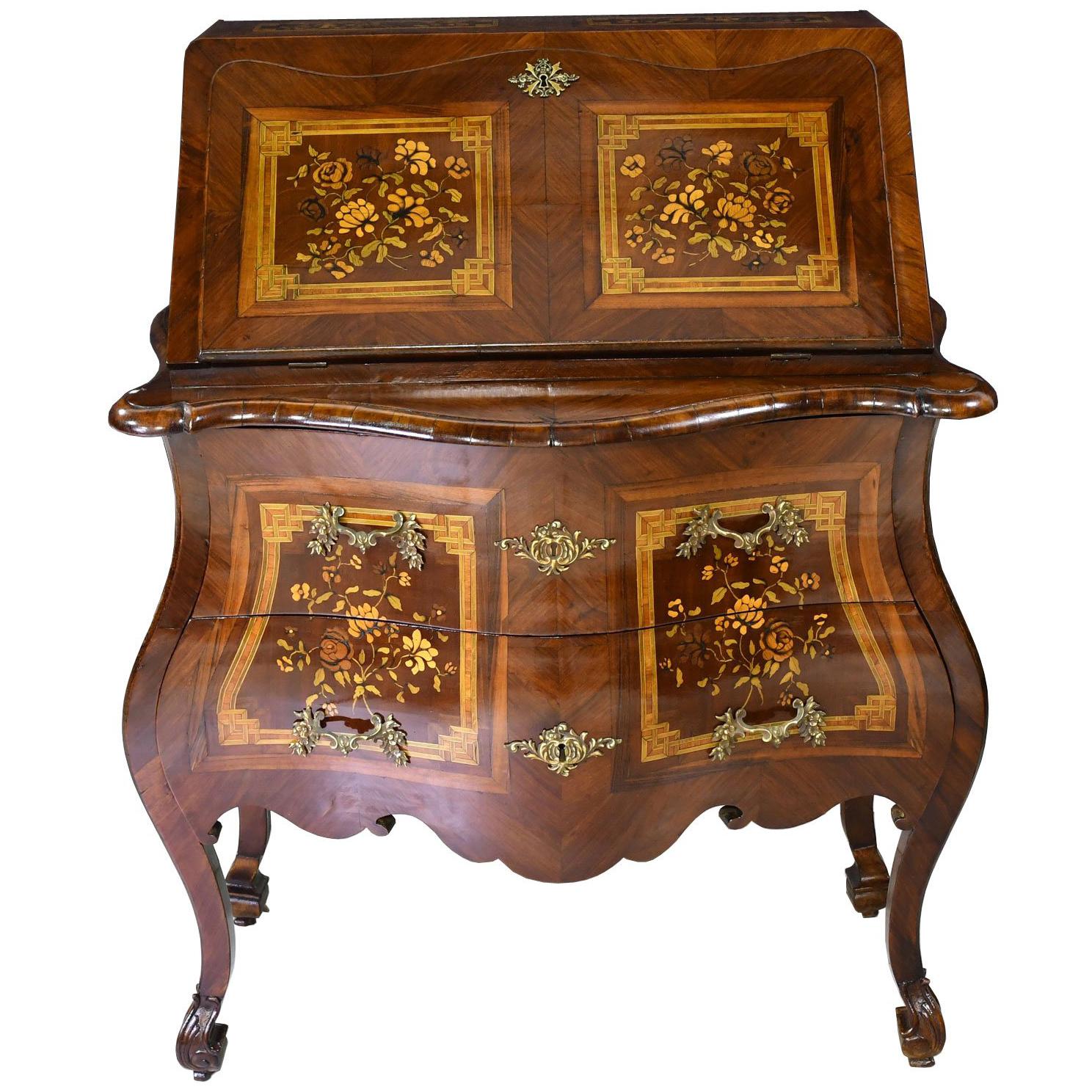 An exquisite 19th century Rococo secretary in mahogany with bombe front & sides, with floral & foliate inlays in tulipwood, kingwood & satinwood on the top, front panels of the drawer, slant-top, and sides. Marquetry inlays on the lower sides of the