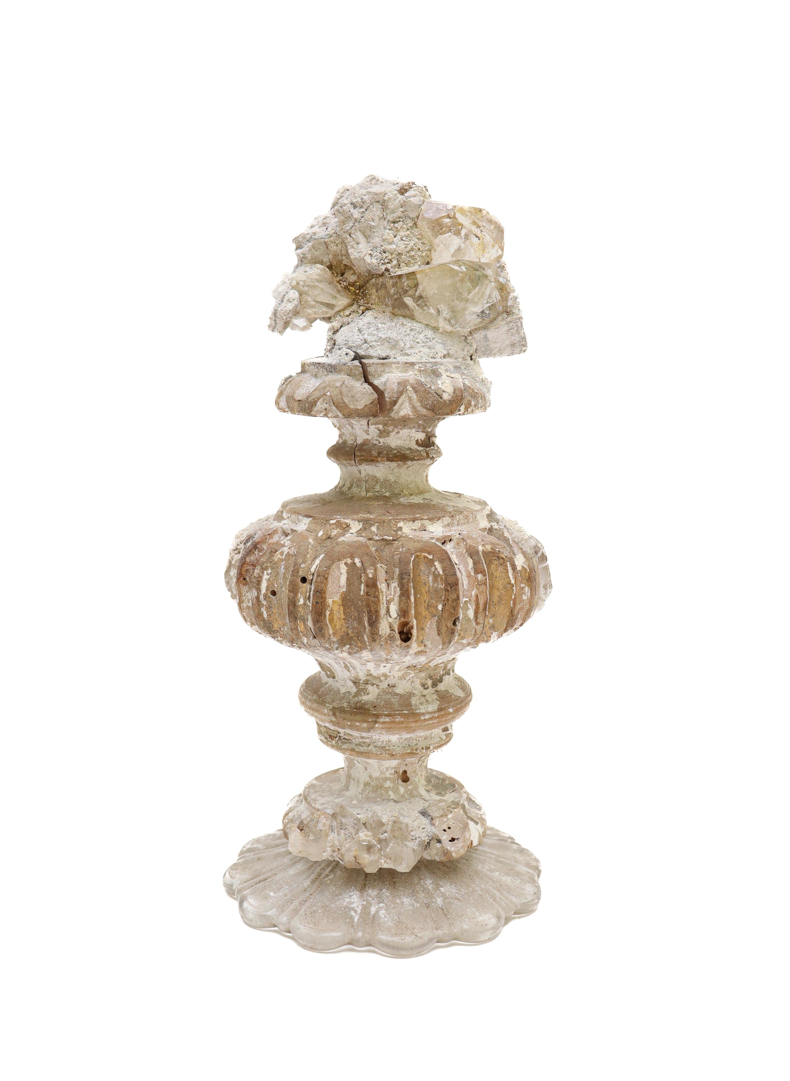 18th century Italian fragment with a calcite crystal cluster in matrix mounted on a Italian glass bobeche base.

The fragment is from a church in Florence. It was found and saved from the historic flooding of the Arno River in 1966. This piece has