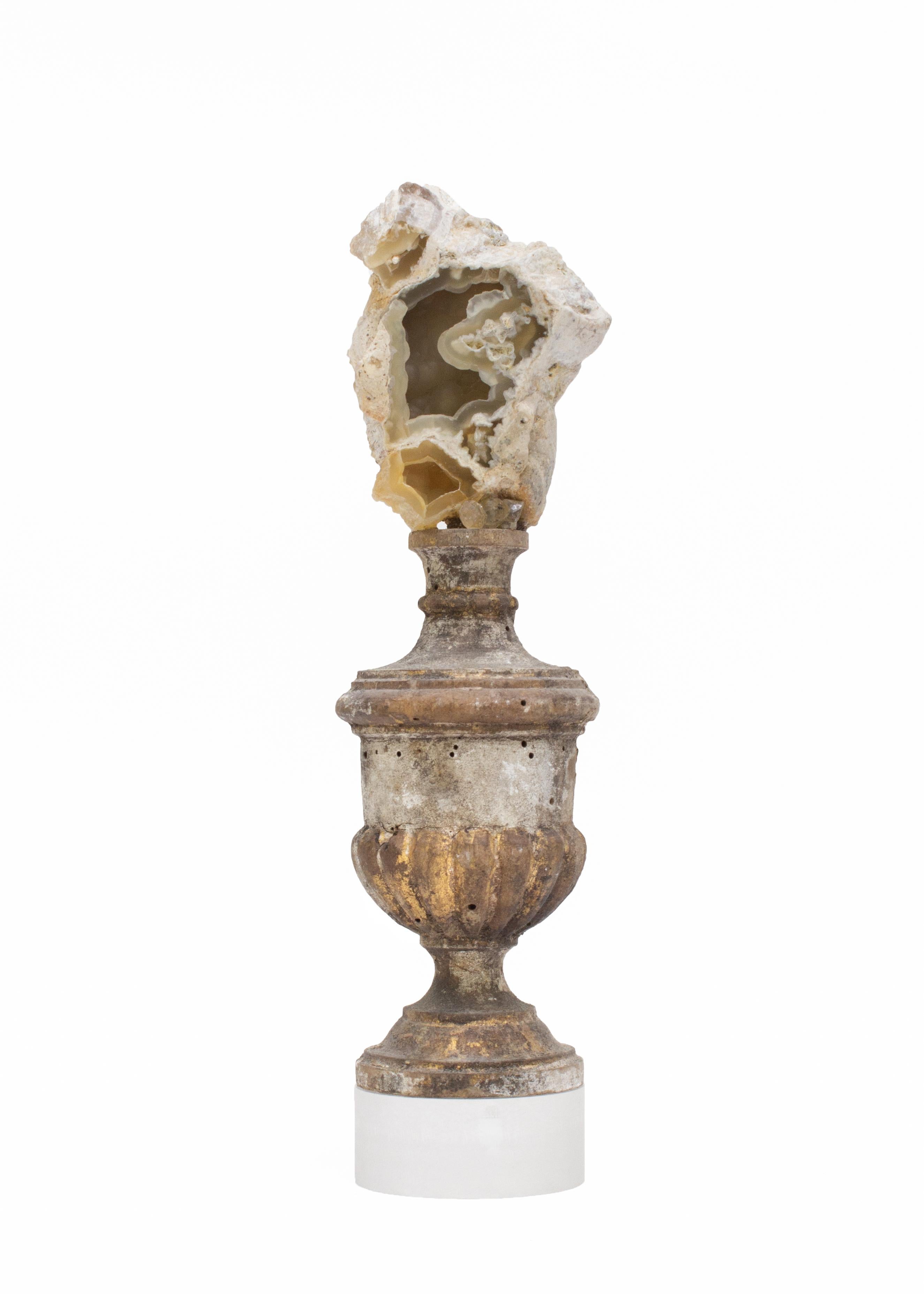 18th century Italian fragment with fossil agate coral and Herkimer diamonds on a lucite base.

Fossil agate coral is mounted on top of the artifact. Fossil agate coral is Florida's state stone and is known for its unique formation that can take