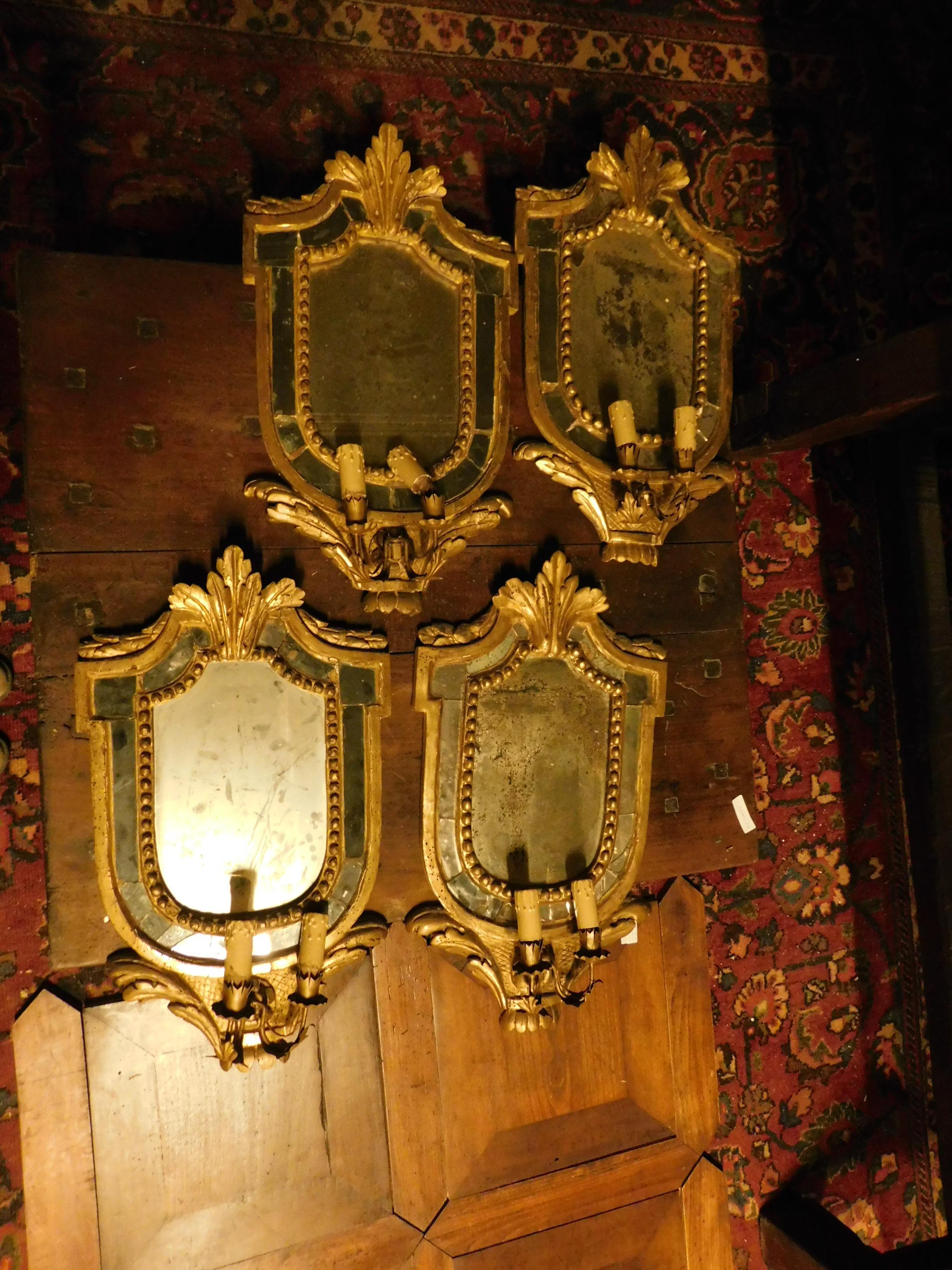 18th century four antique golden frames with mirrors, second half of the 18th century, measures: height cm 63 x 36 width, with candleholder, from Piedmont (Italy).