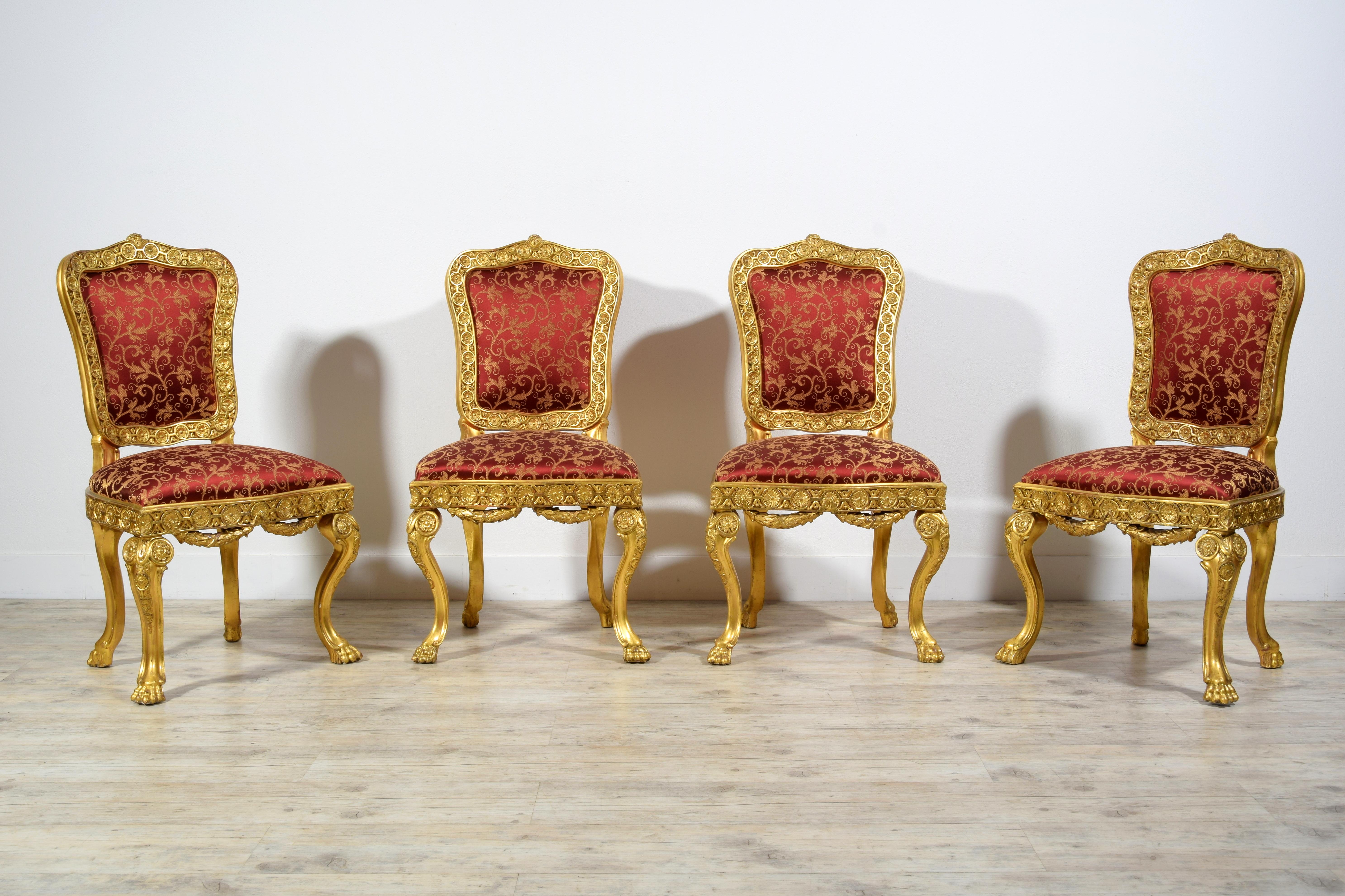 18th Century Four Italian Baroque Carved giltwood Chairs 

The four fine chairs were made in Rome (Italy) around the middle of the eighteenth century in the Baroque era.
The carved and gilded wooden structure has sculptures with floral and