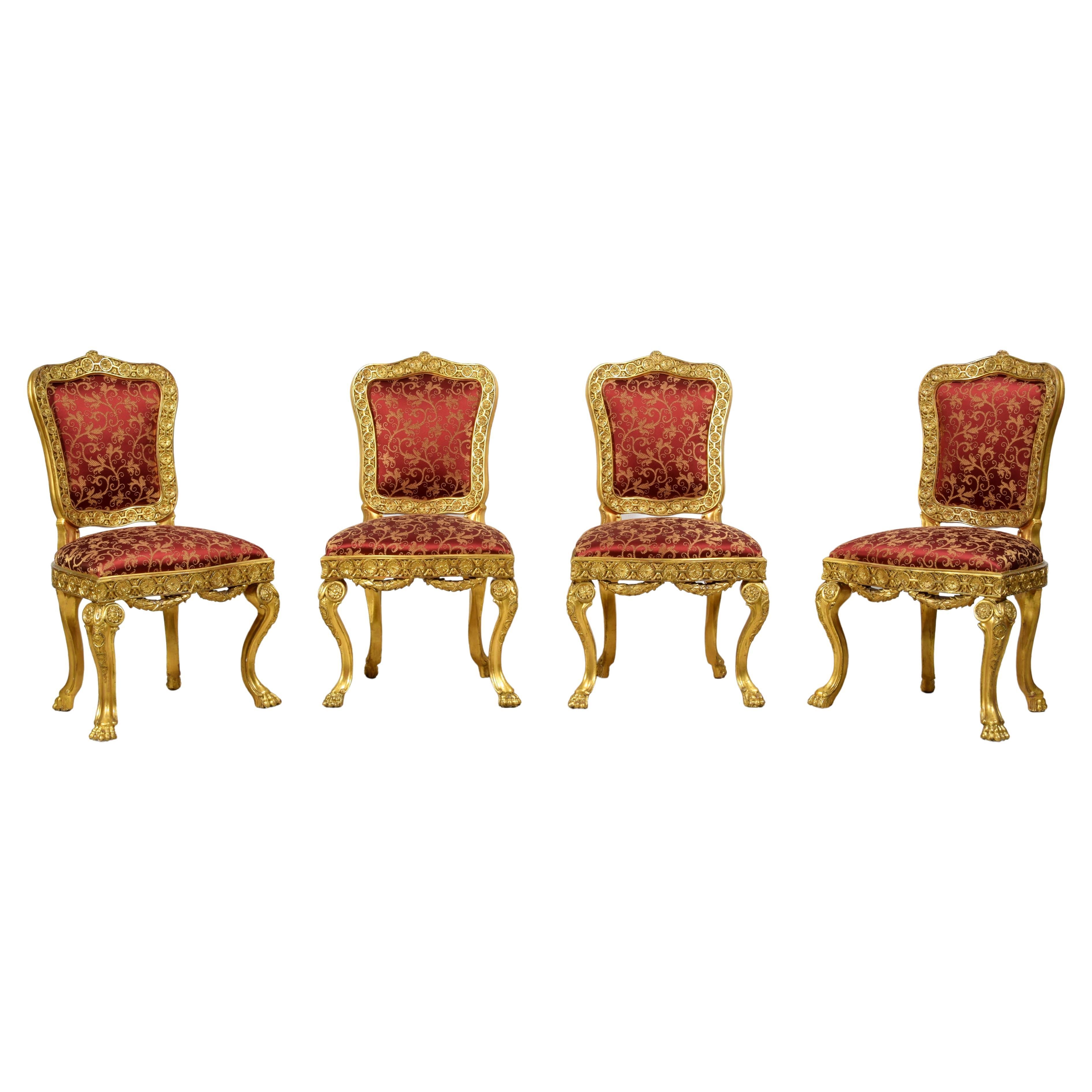 Quatre chaises baroques italiennes en bois doré sculpté du XVIIIe siècle 