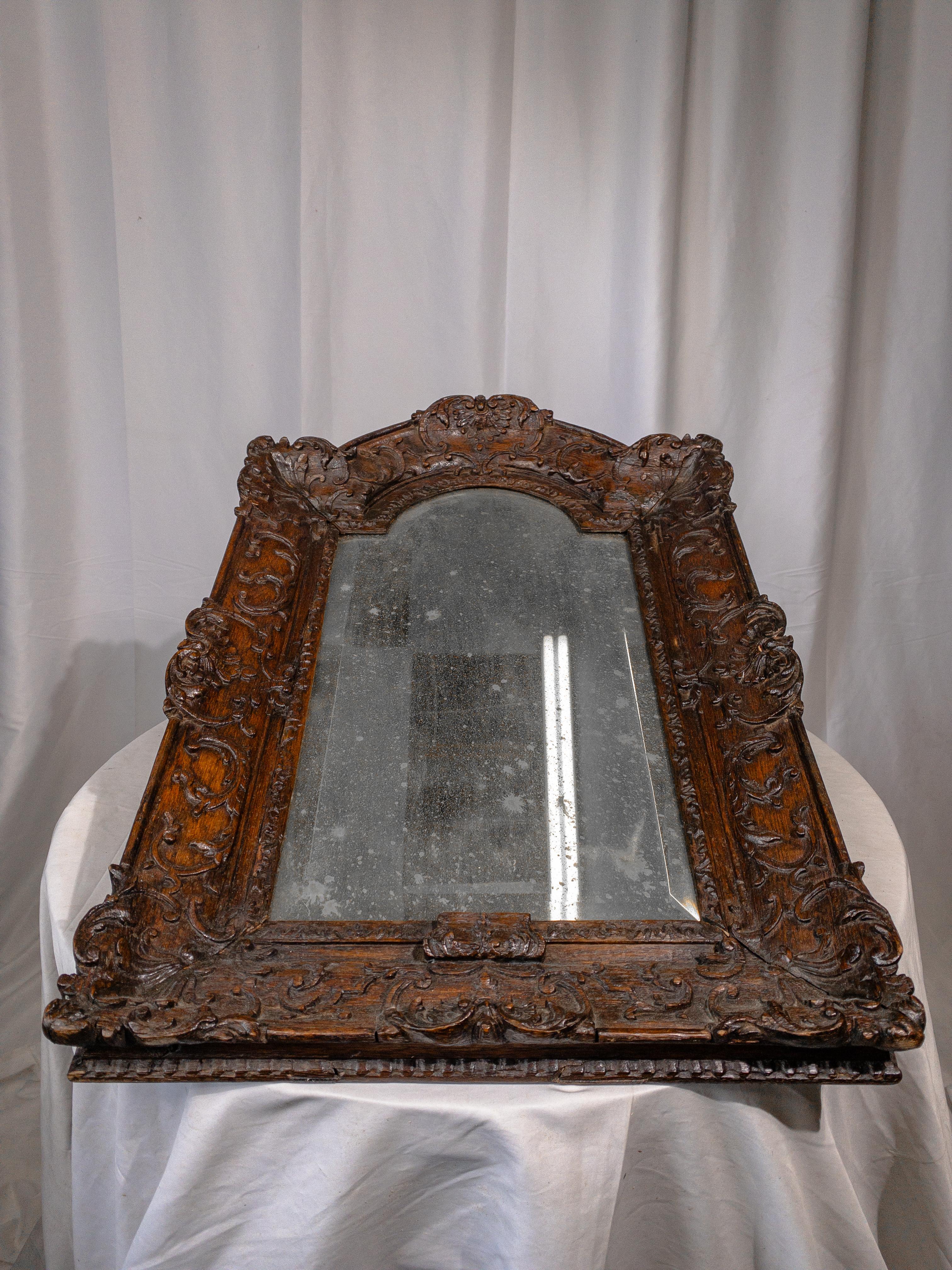 Renaissance 18th Century Foxed Mirror in Carved Wooden Frame For Sale