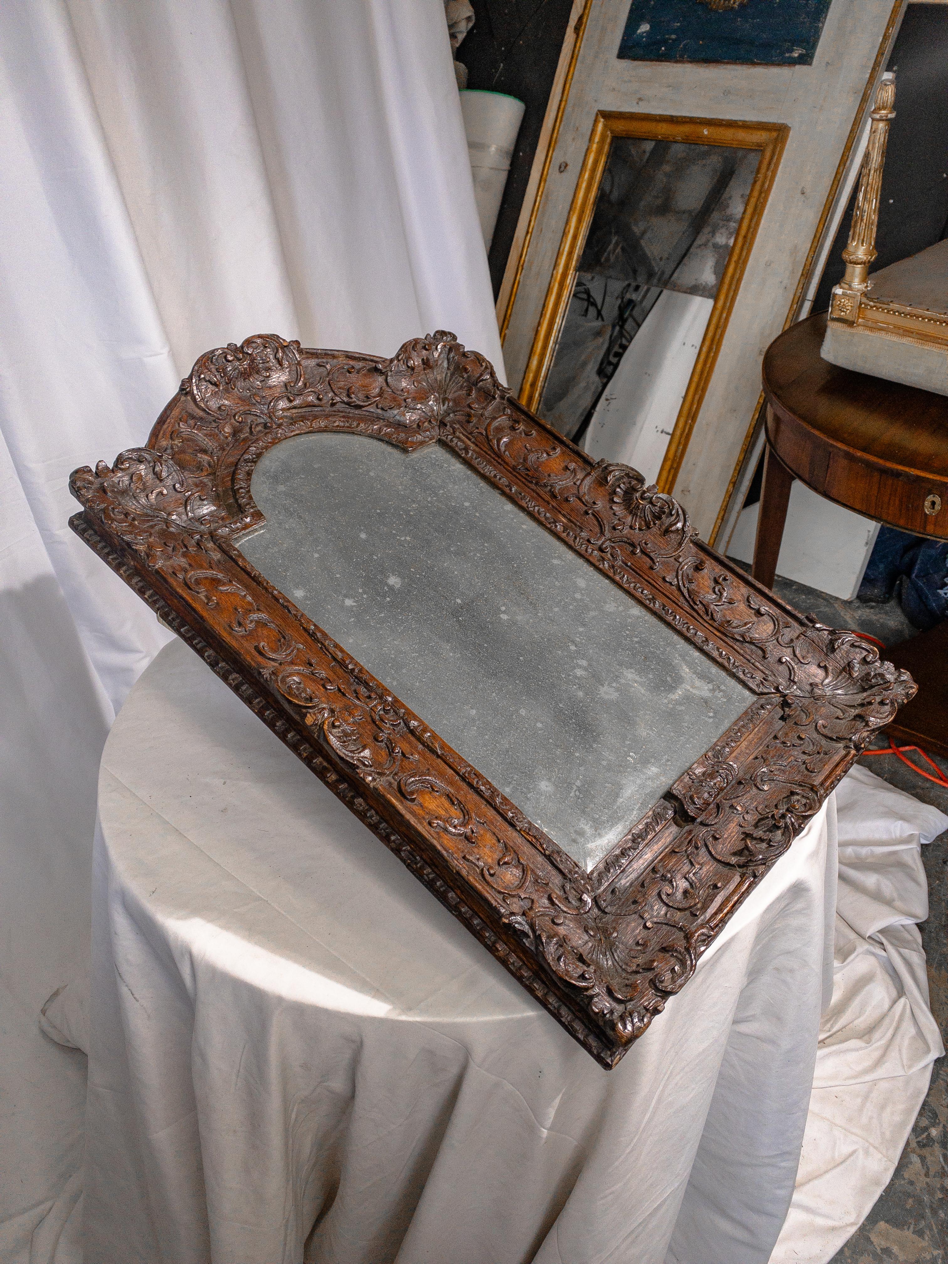 Italian 18th Century Foxed Mirror in Carved Wooden Frame For Sale