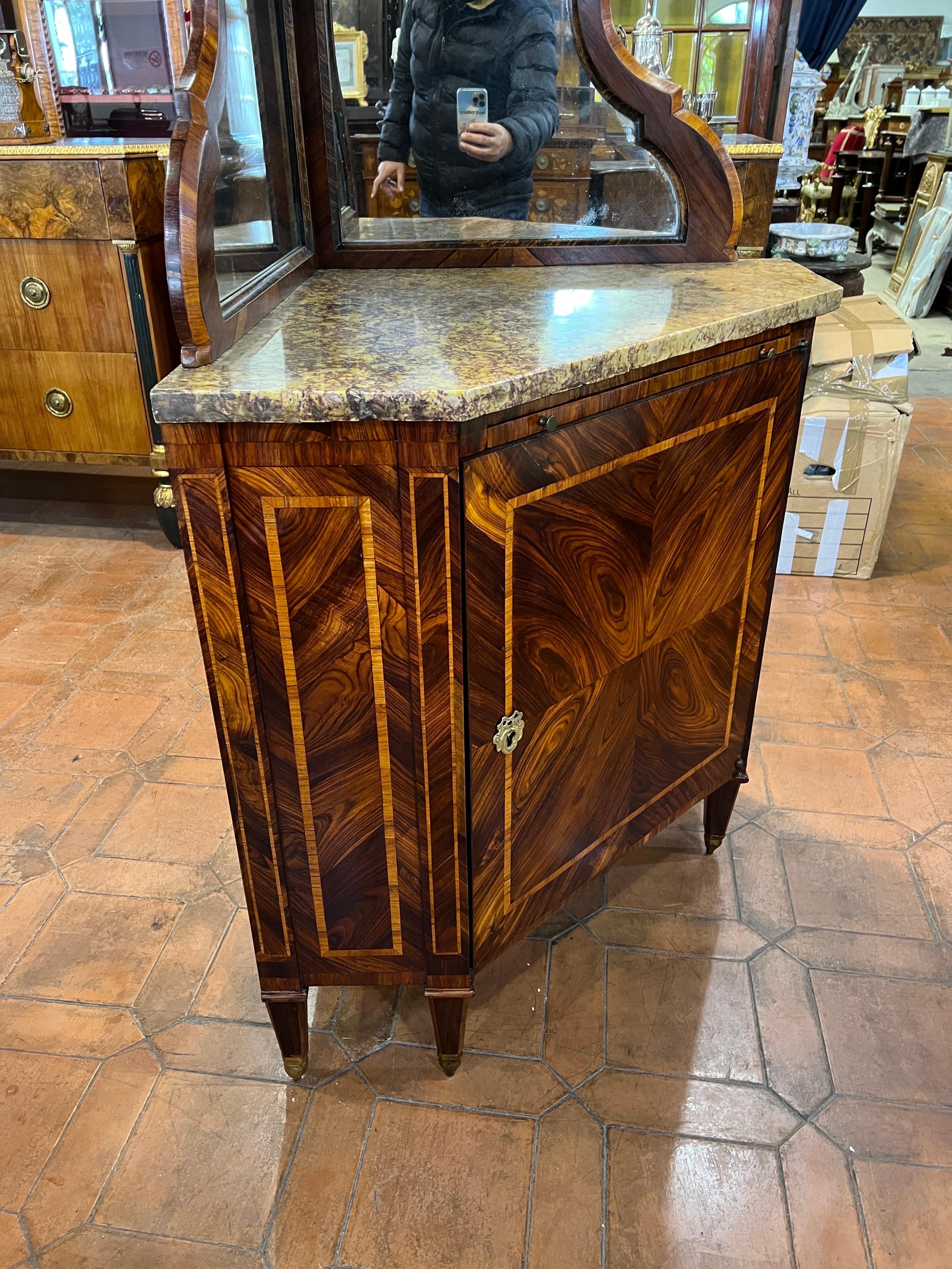 Large French two-body corner piece, Louis XVI era , circa 1770-1780. In Kingwood and inlaid in ebony, coeval marble and in very good condition. On the front drawer desk with leather , inside the door drawer with movable compartments.
Two panes of