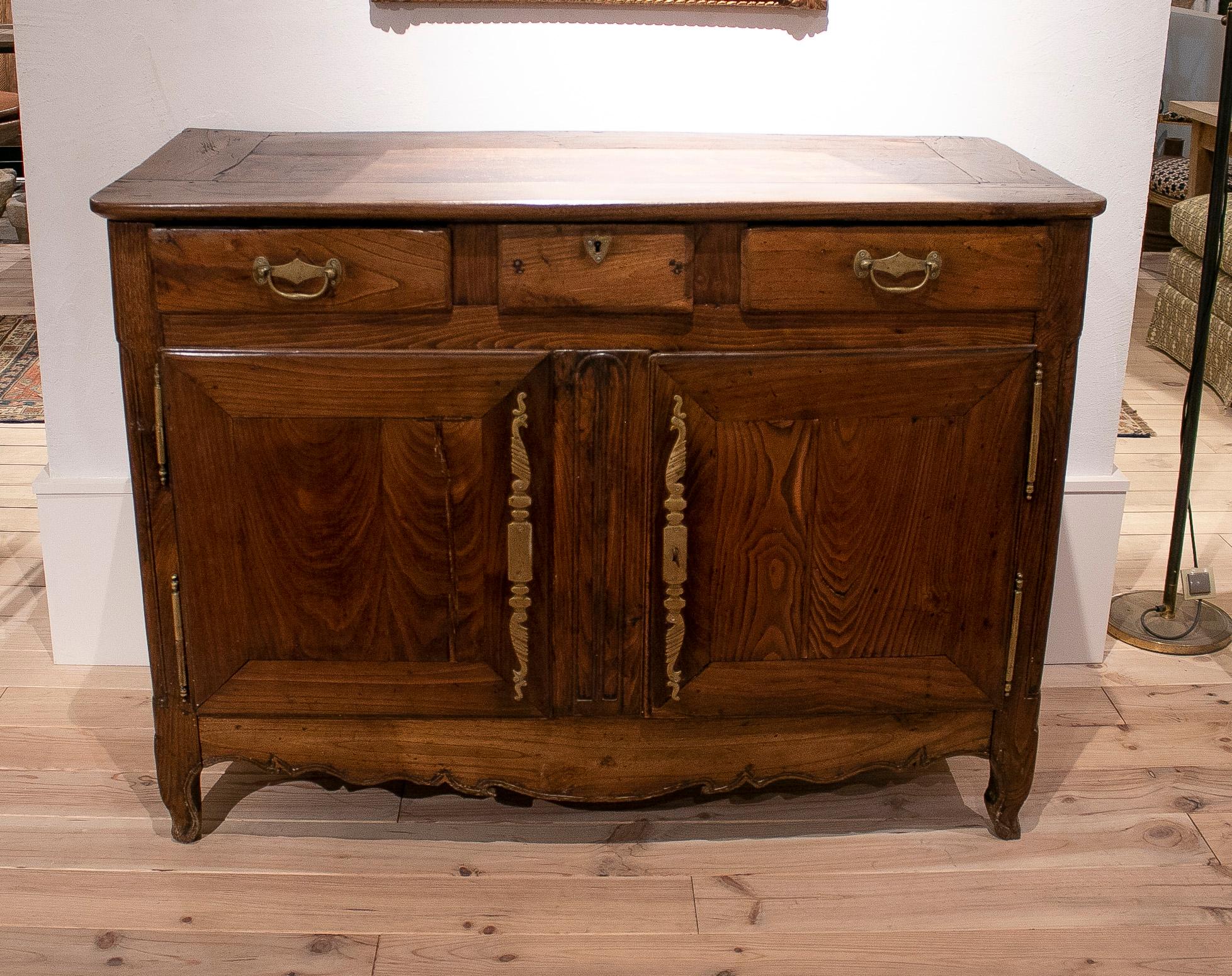 18th century French 2-door 3-drawer console table with bronze hardware.

  