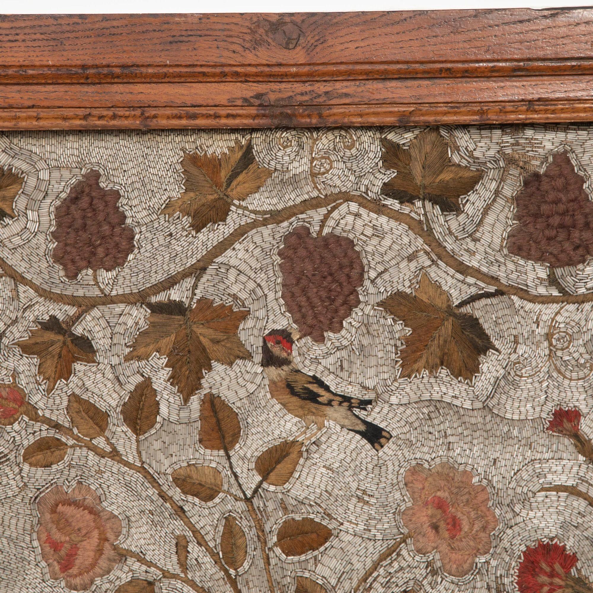18th Century front panel of an altar. 
This panel is originally from the private chapel of an important house in Montelimar. With beautiful decorative stitched floral design with flowers and birds, surrounding a depiction of the Paschal Lamb