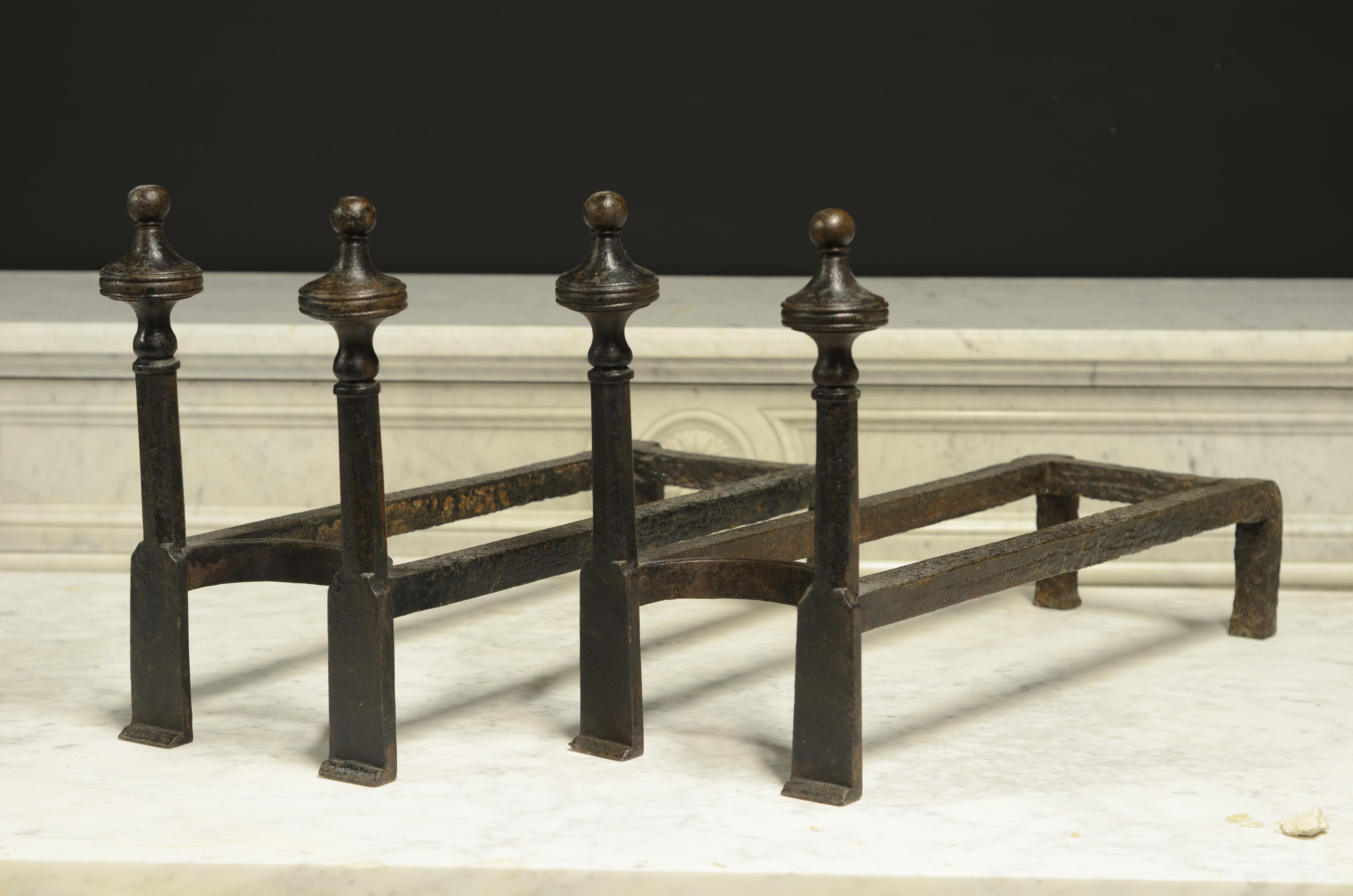 A nice original set of French andirons.
Showing the beautiful craftsmanship of the blacksmiths from the 18th century.

This pair is in great condition with the perfect used patina.

The double bars make stacking the fire easier and safer they