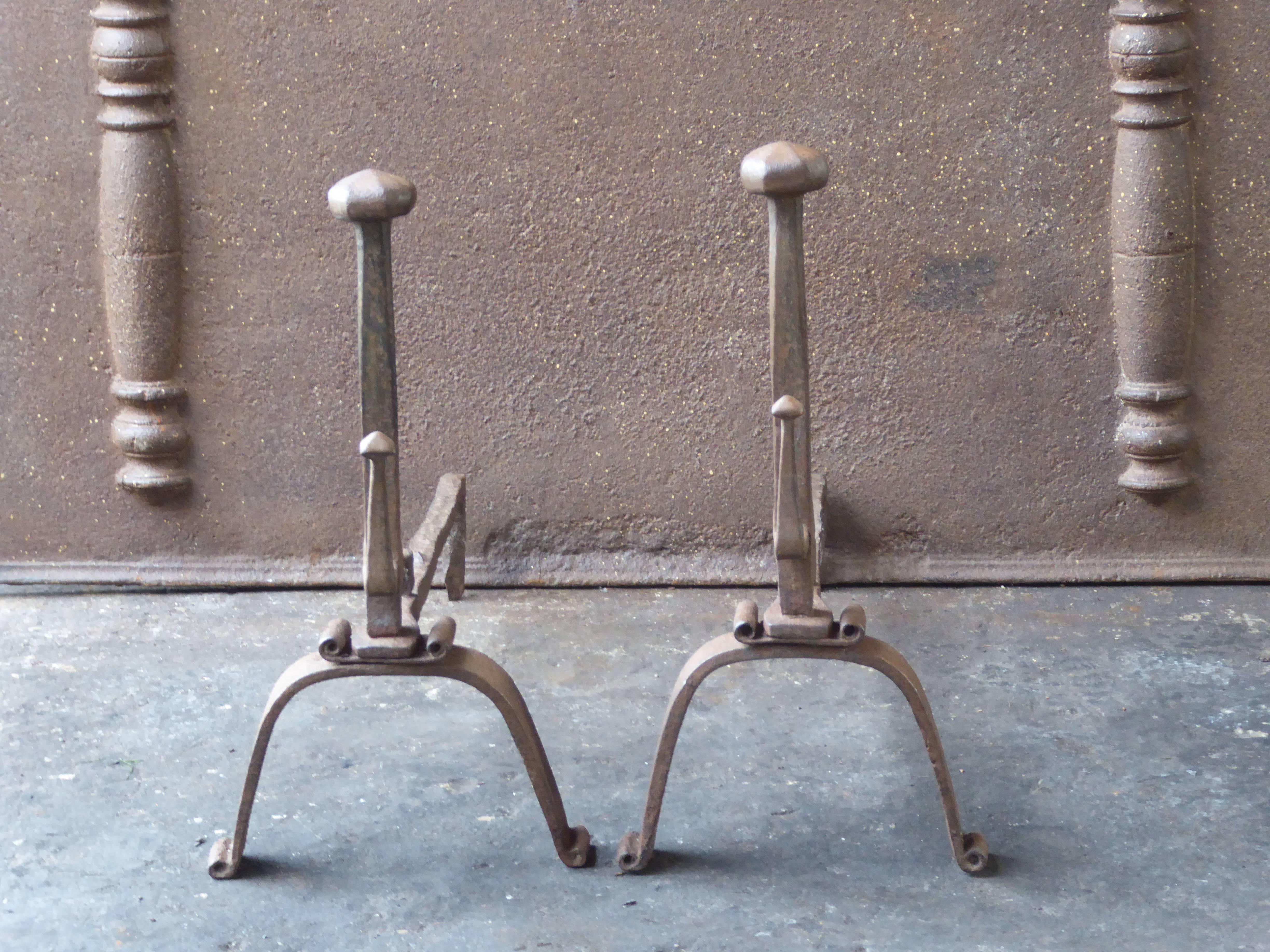 18th century French andirons made of wrought iron. The andirons have spit hooks to grill food. The condition is good.

