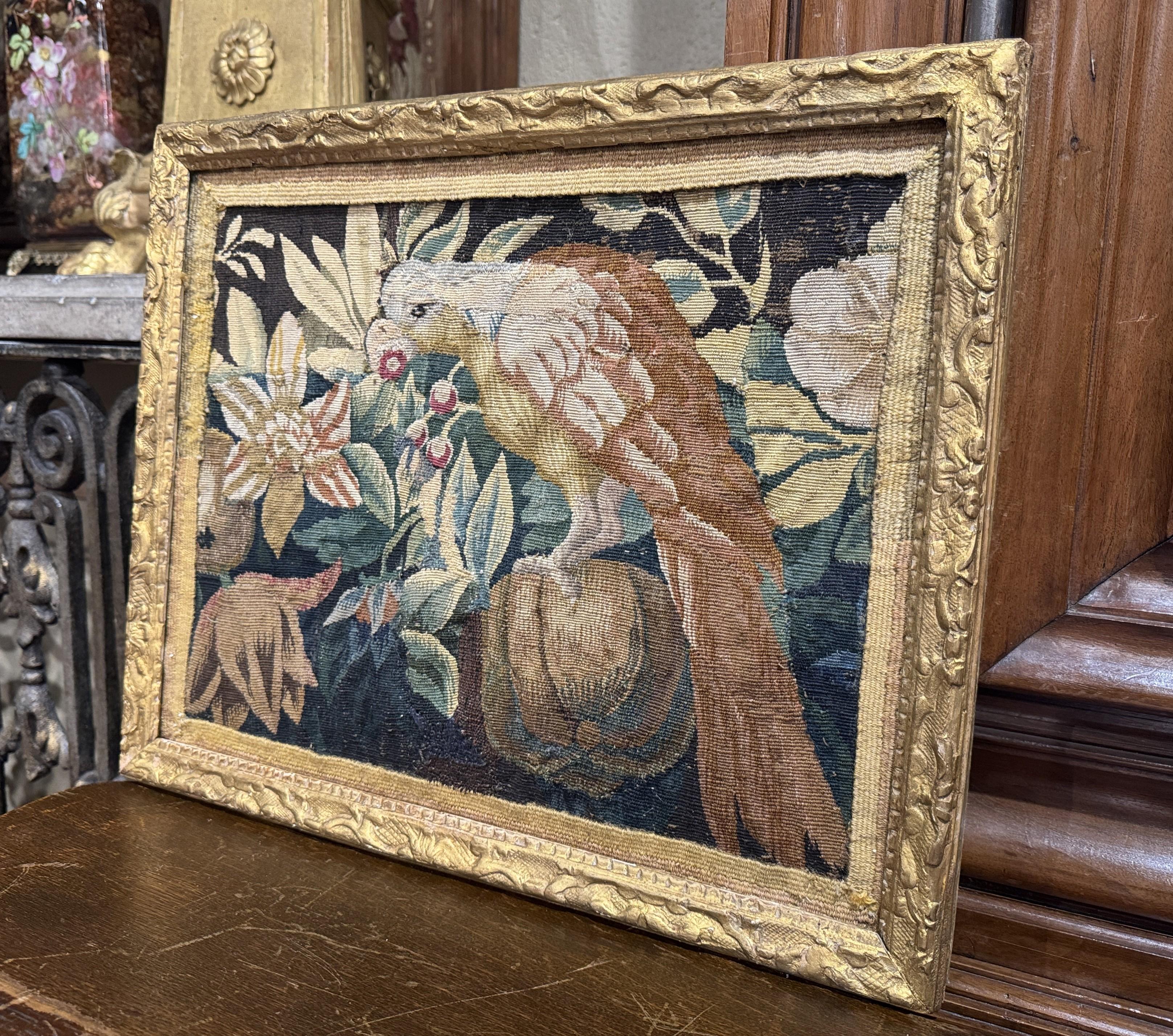 Decorate a wall with this colorful 18th-century Aubusson tapestry fragment. Hand woven in France circa 1750, the tapestry depicts a richly woven bird nestled amid a lush arrangement of flowers, berries, and gourds. Characteristic of the Rococo