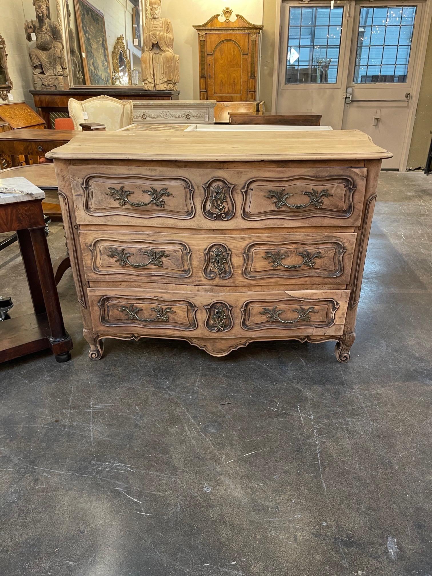 Lovely 18th century French bleached walnut large scale commode. The piece also has nice carvings and ample storage. Fabulous!