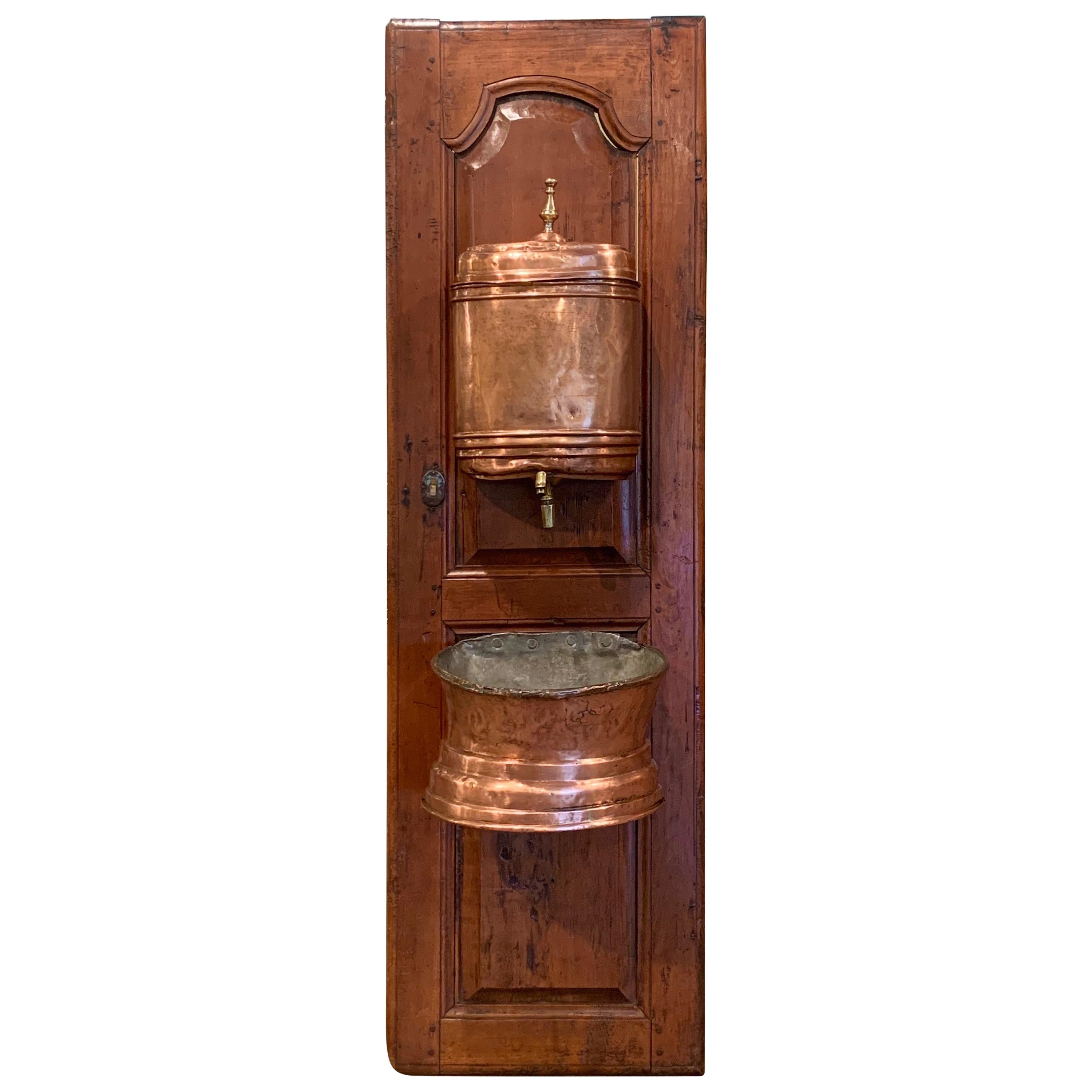 18th Century French Brass Lavabo Fountain from Normandy on Carved Cherry Door