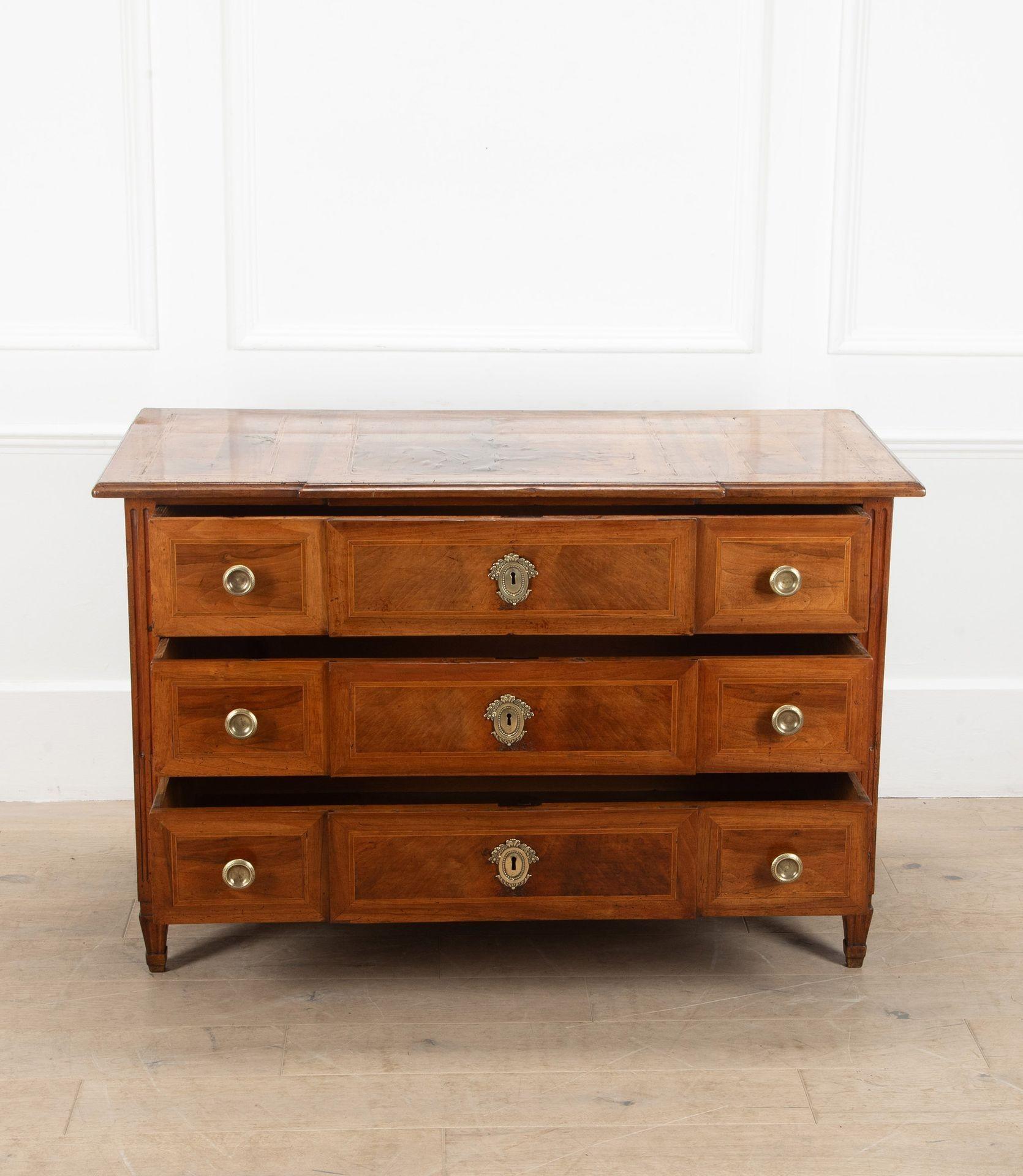A good example of an 18th Century French, Alsace region, walnut commode.
With satinwood stringing and good colour and patina. With antique handles which complete this attractive and functional piece.