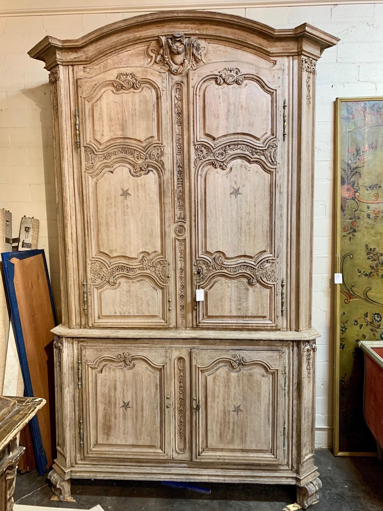 Fabulous 18th century French carved and bleached oak buffet du corps. Gorgeous bleached finish and very fine carvings as well. Large amount of storage make this functional as well as beautiful!