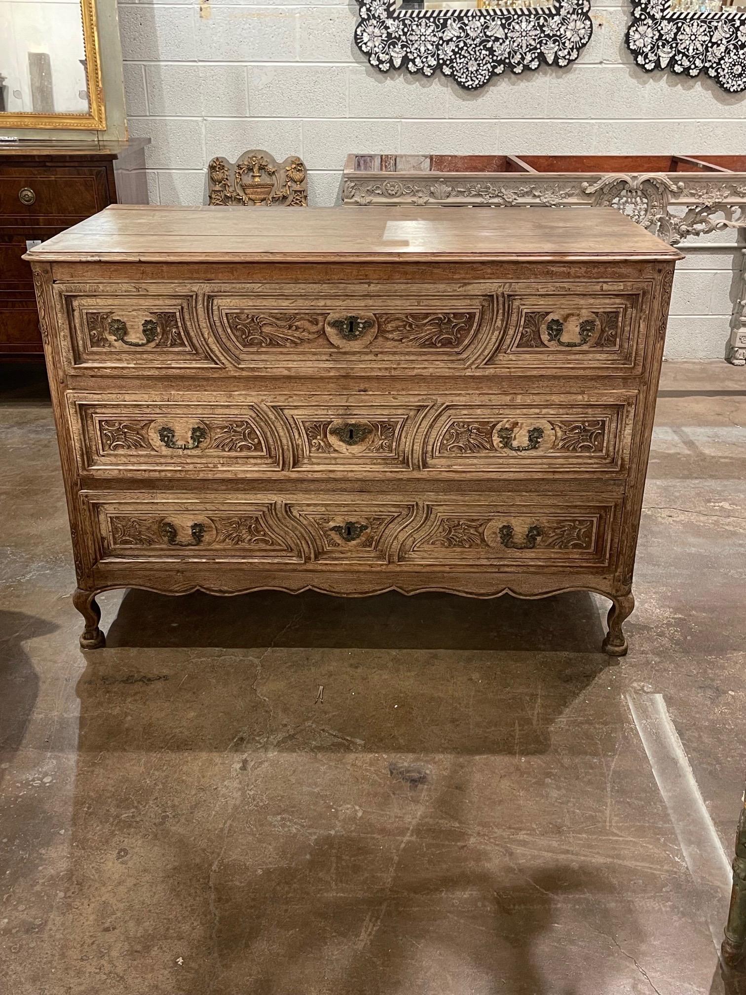 Handsome 18th century French carved and bleached oak commode. Pretty carvings and lovely patina! A very special piece!
