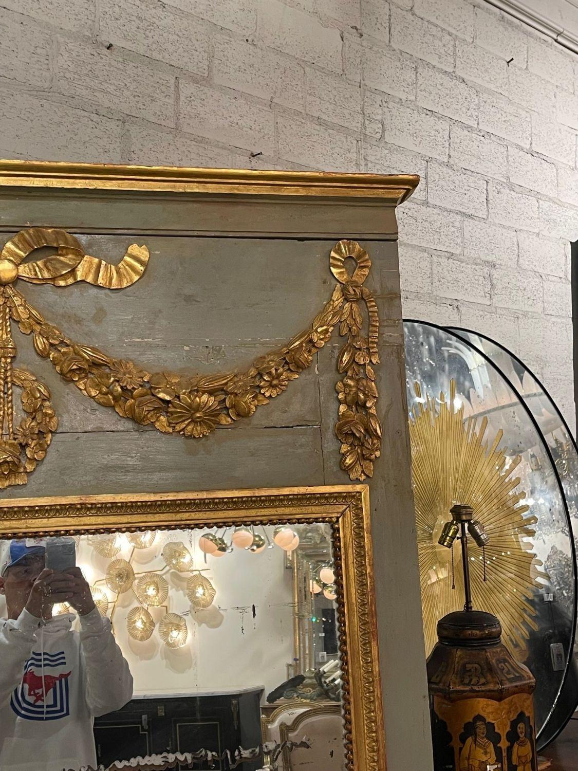 Hand-Carved 18th Century French Carved and Parcel Gilt Trumeau Mirror For Sale