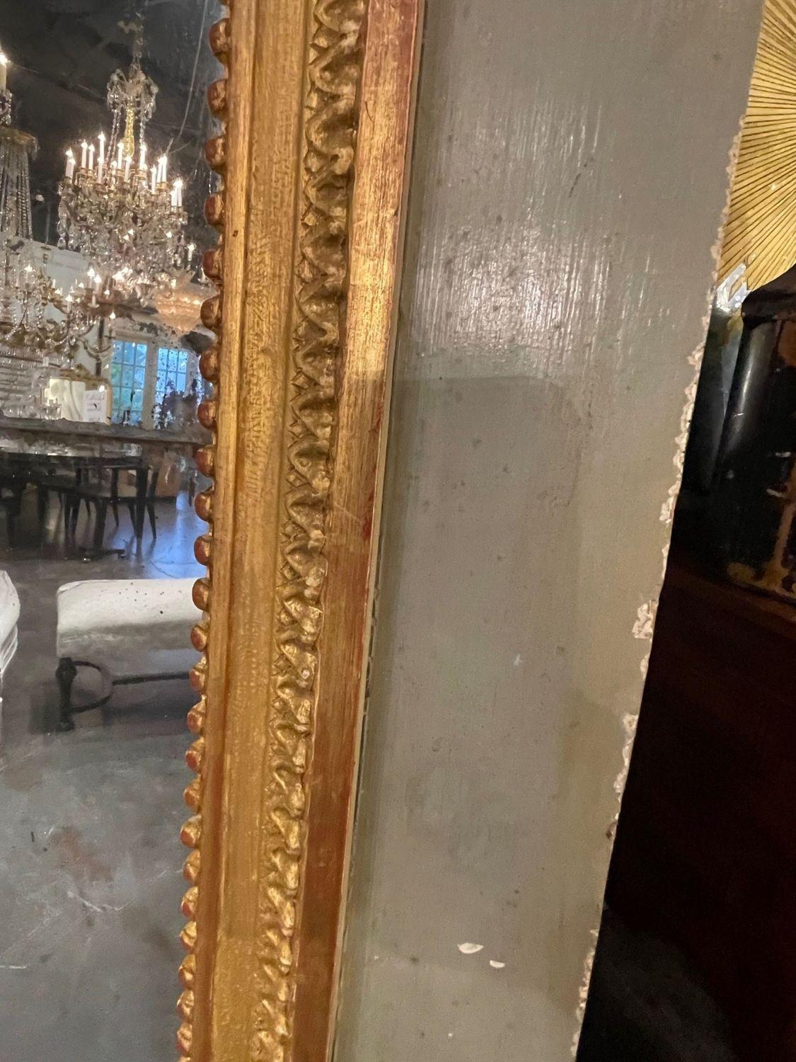 XVIIIe siècle et antérieur Miroir Trumeau du XVIIIe siècle, sculpté et doré à la feuille. en vente