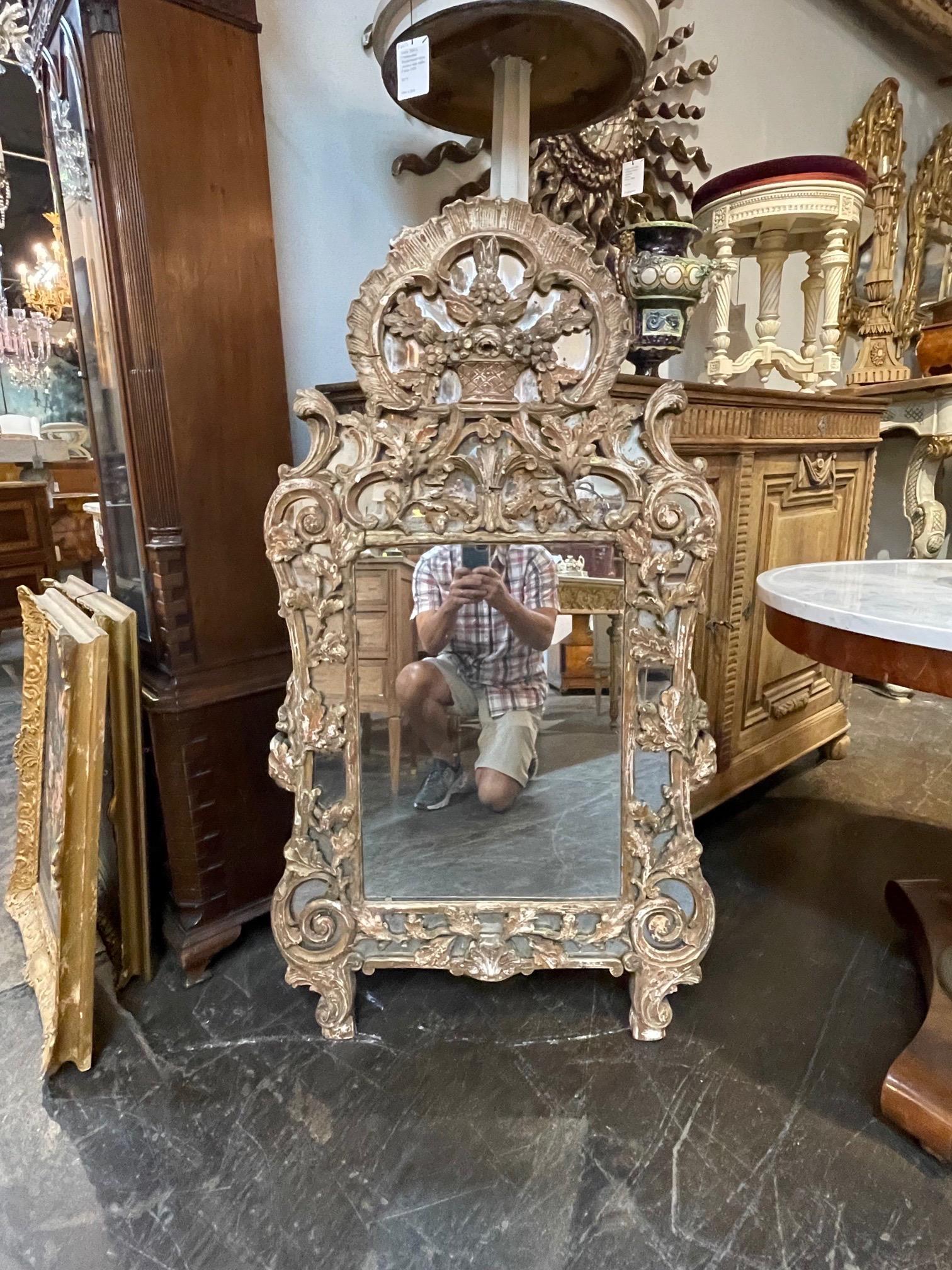Exceptional 18th century French carved mirror. Very fine carvings on this piece and great patina as well. Gorgeous!!