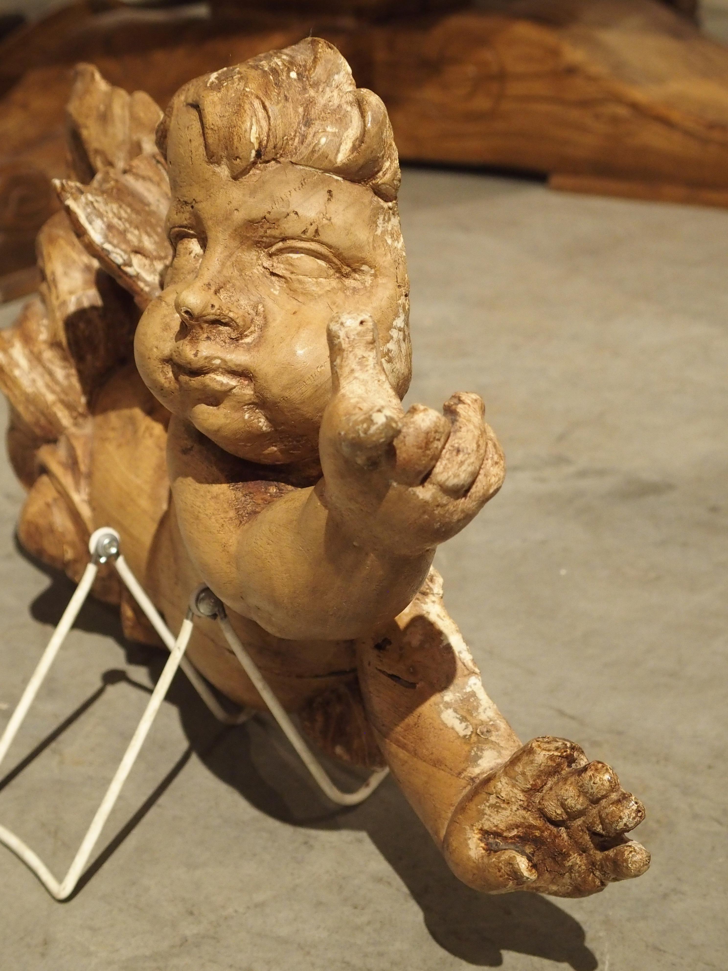 Wood 18th Century French Carved Sculpture of a Flying Cherub For Sale