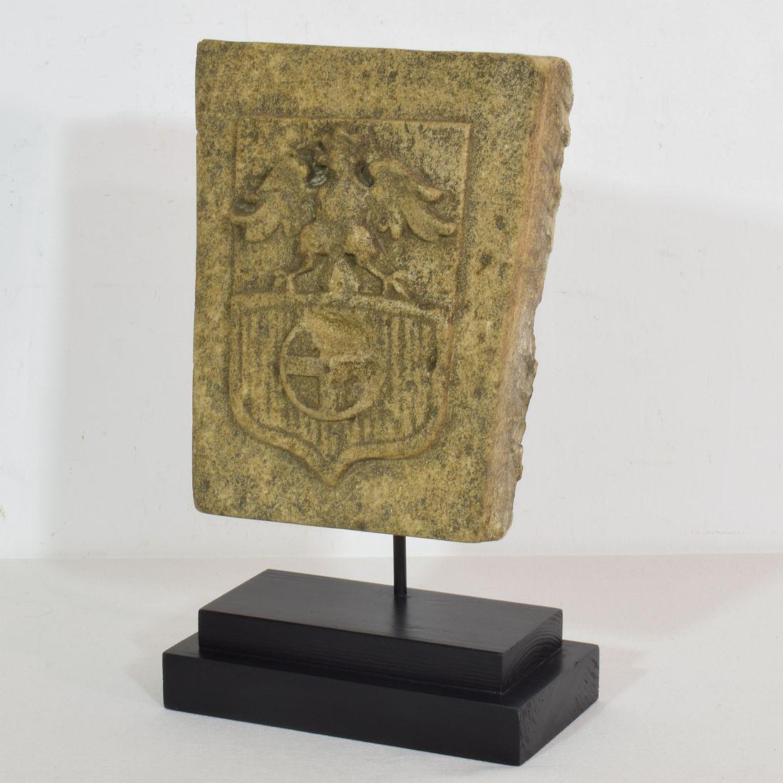 Very beautiful hand carved limestone coat of arms with a crowned eagle. Great weathered patina
France, circa 1750. Weathered and small losses.
Measurement here below is inclusive the wooden base.