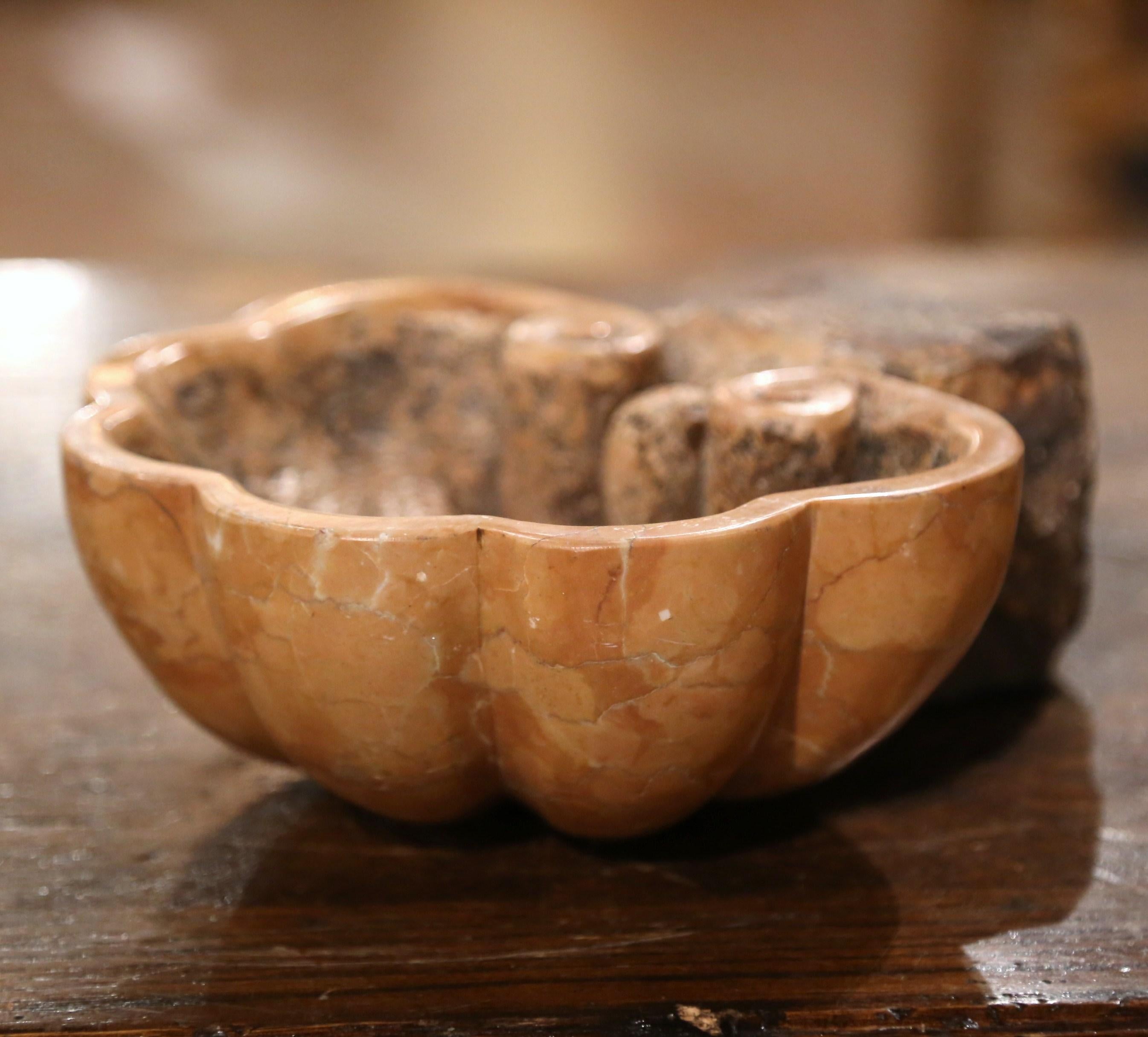 Hand carved in France circa 1750, this antique shell form dish was originally at the entrance door of a private chapel; in its original placement, this stoup was inserted into the wall and was used to hold the Holy Water. The variegated beige marble