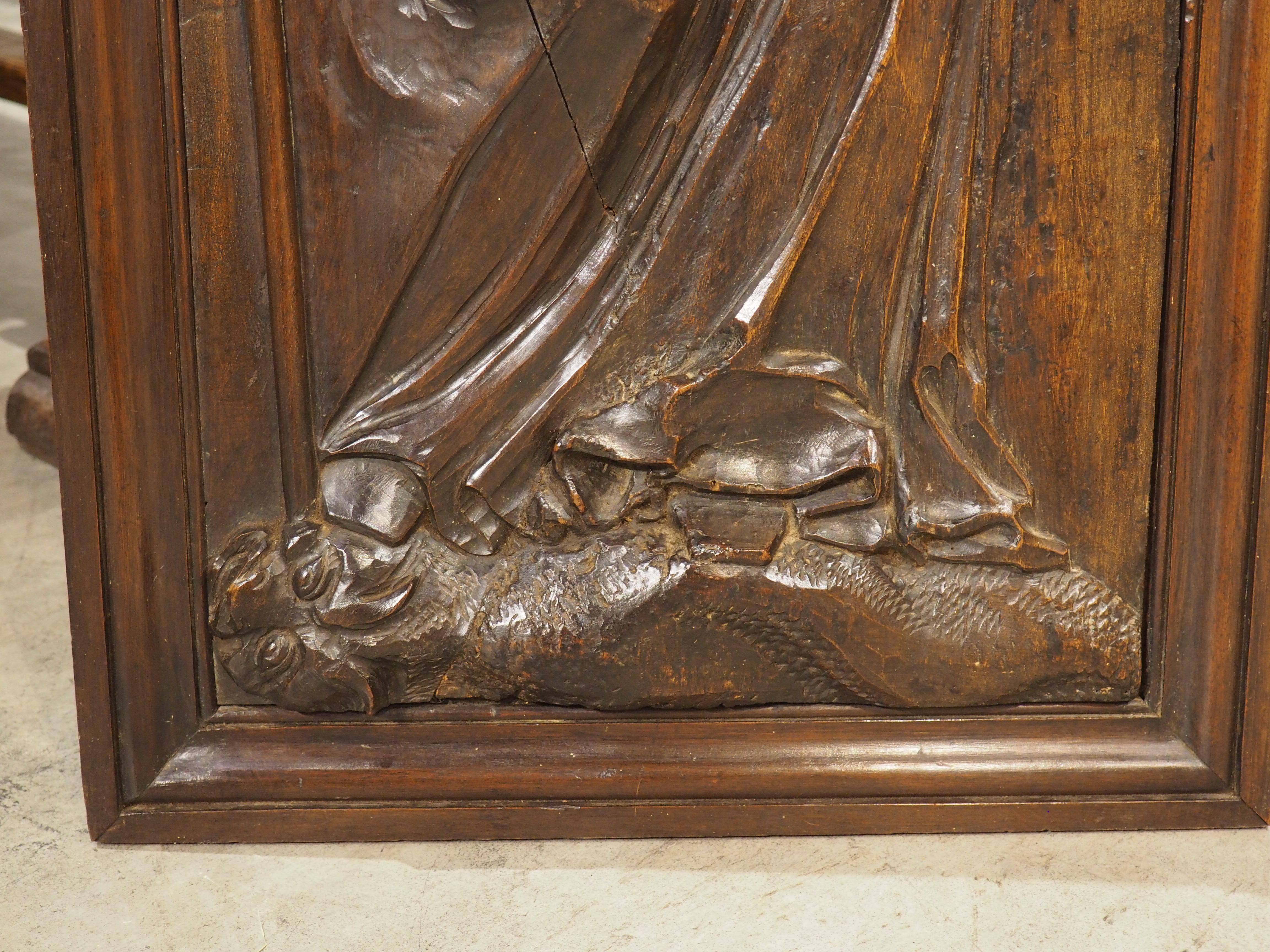 18th Century French Carved Walnut Panel of Saint Radegonde and The Grand’Goule In Good Condition For Sale In Dallas, TX