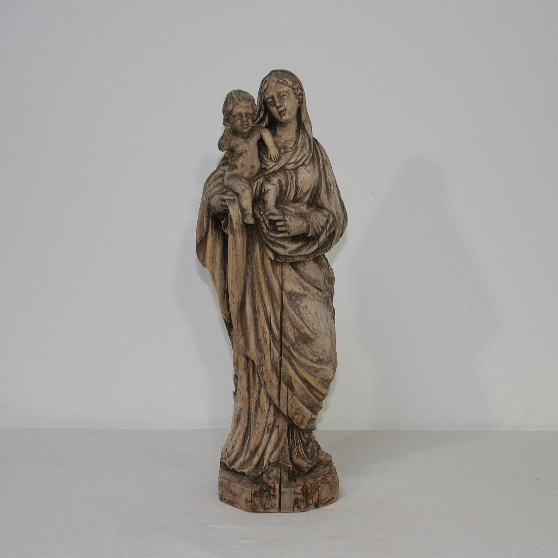 Beautiful naive Madonna with child. Stunning patina.
France 18th century.
Weathered and small losses.
