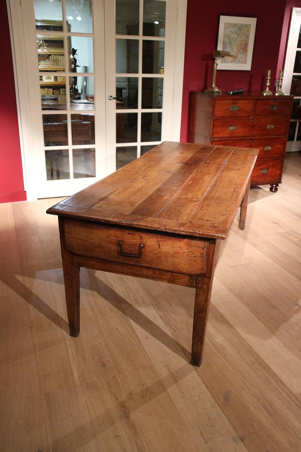 Beautiful 18th century cherrywood dining table. Table has one large drawer and two small ones. The table is in perfect condition considering its age. It has a wonderful rich color and superb patination. The old woodworm gives the table a beautiful