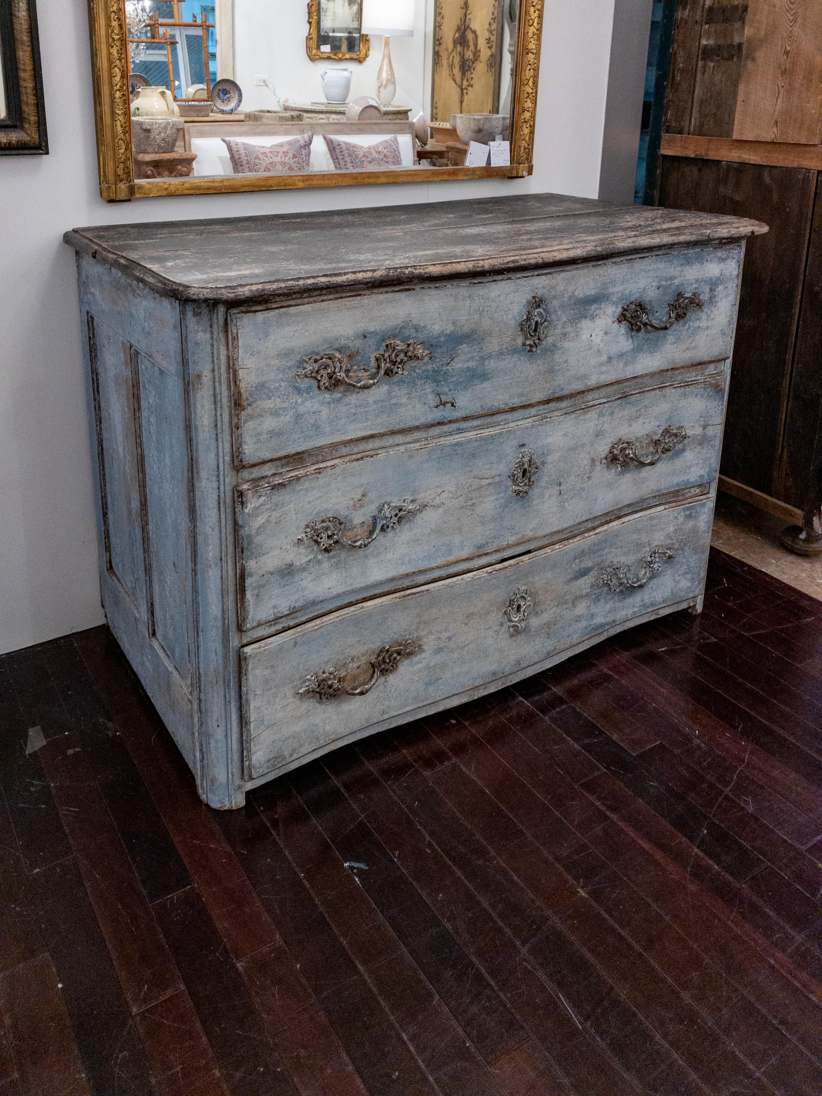 The 18th century French commode is a stunning example of furniture from that era. It features three drawers, providing ample storage space for your belongings. The original hardware, such as handles and escutcheons, adds a touch of authenticity and