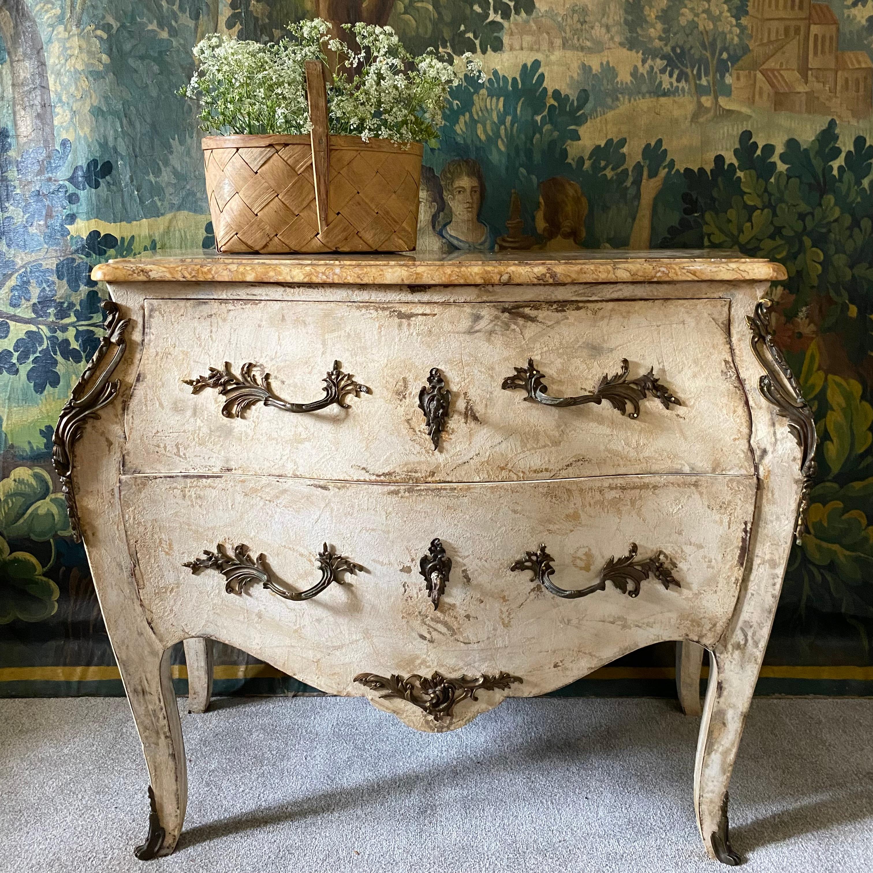 A superb high quality 18th century French rococo bombe shaped commode - in oak with two deep drawers in a faux marble painted finish with a beautiful real shaped marble top - the metal decorations and handles appear to be bronze - the chest and