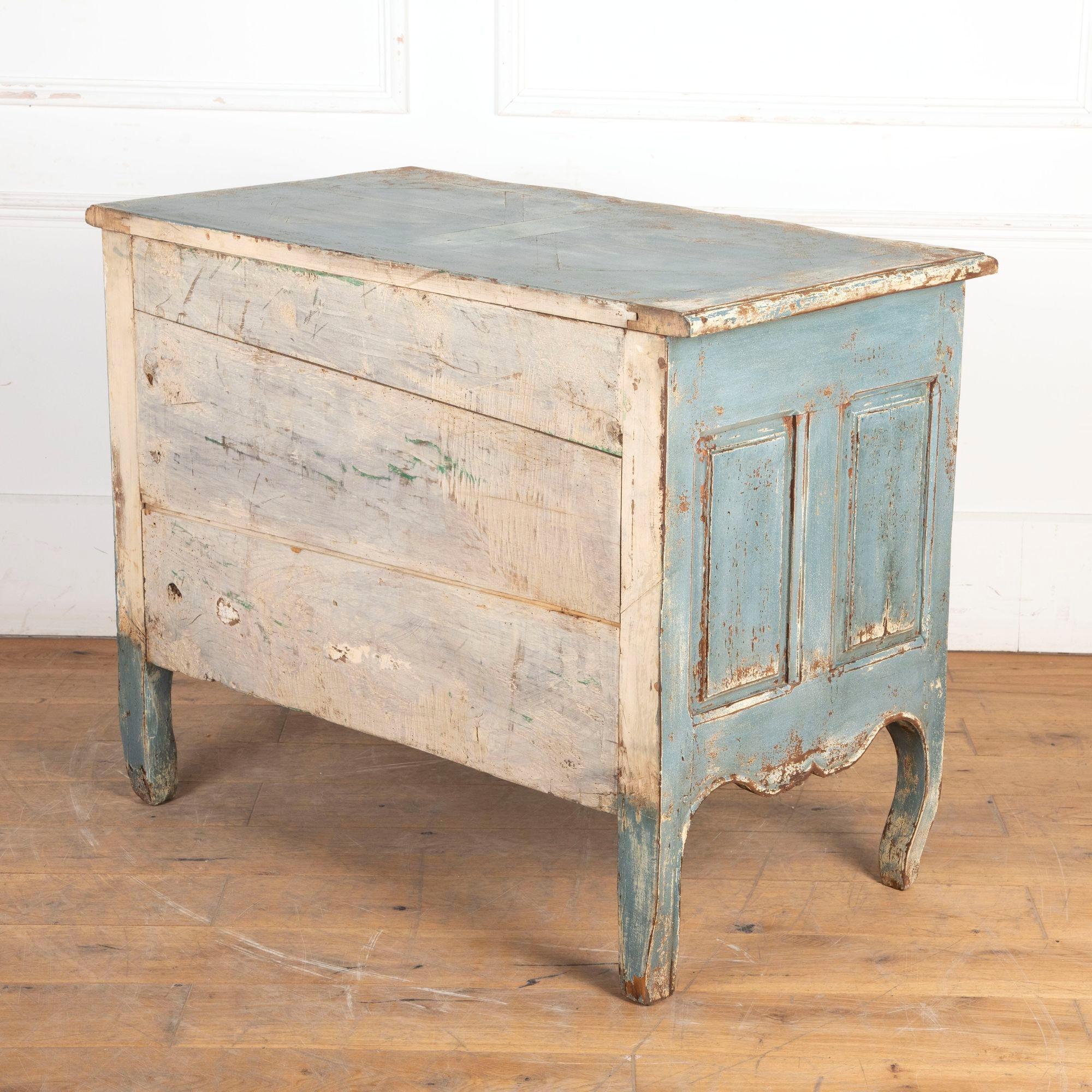 Shapely and robust 18th Century French two-drawer commode with brass handles, escutcheons, and key.
The distressed blue and cream finish has been a later addition.