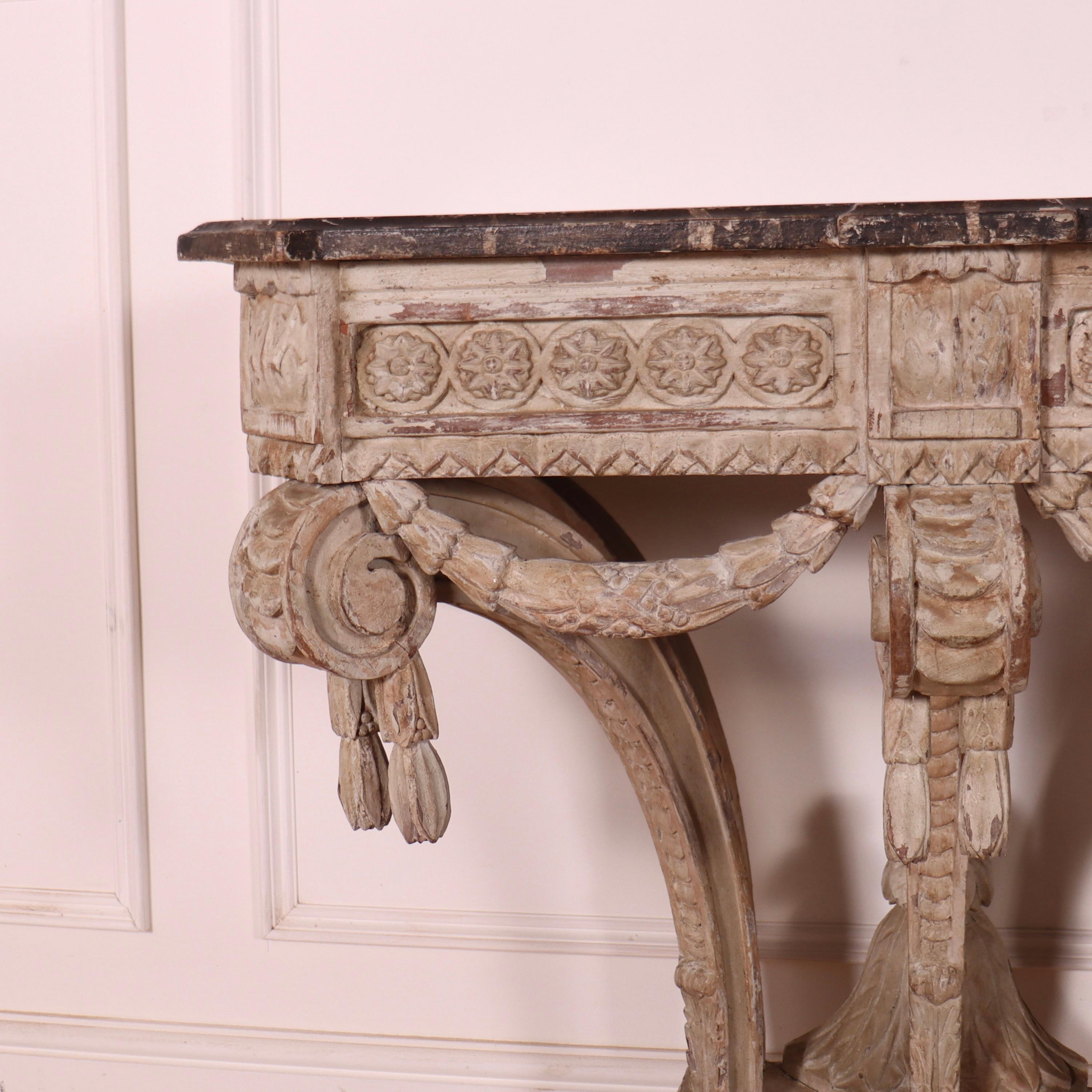 Pretty late 18th Century French painted console table with a faux marble top. All carved wood. 1780.

Dimensions
34 inches (86 cms) Wide
20 inches (51 cms) Deep
32 inches (81 cms) High.