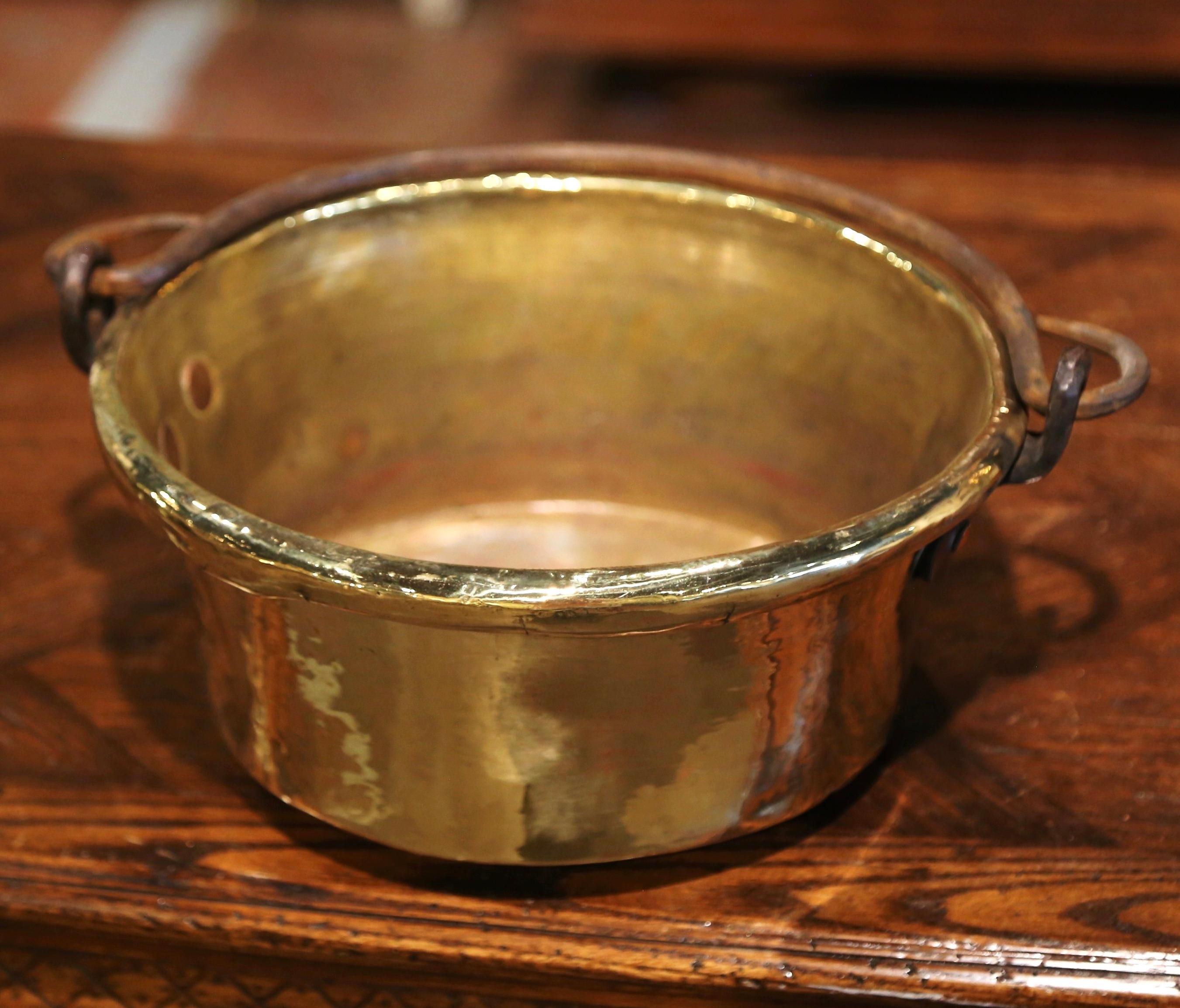 Bring an authentic French countryside touch to your kitchen with this antique copper marmalade bowl. Crafted in Normandy, France, circa 1870, the decorative “Bassine a Confiture” (jelly bowl) is round in shape and dressed with a forged center handle