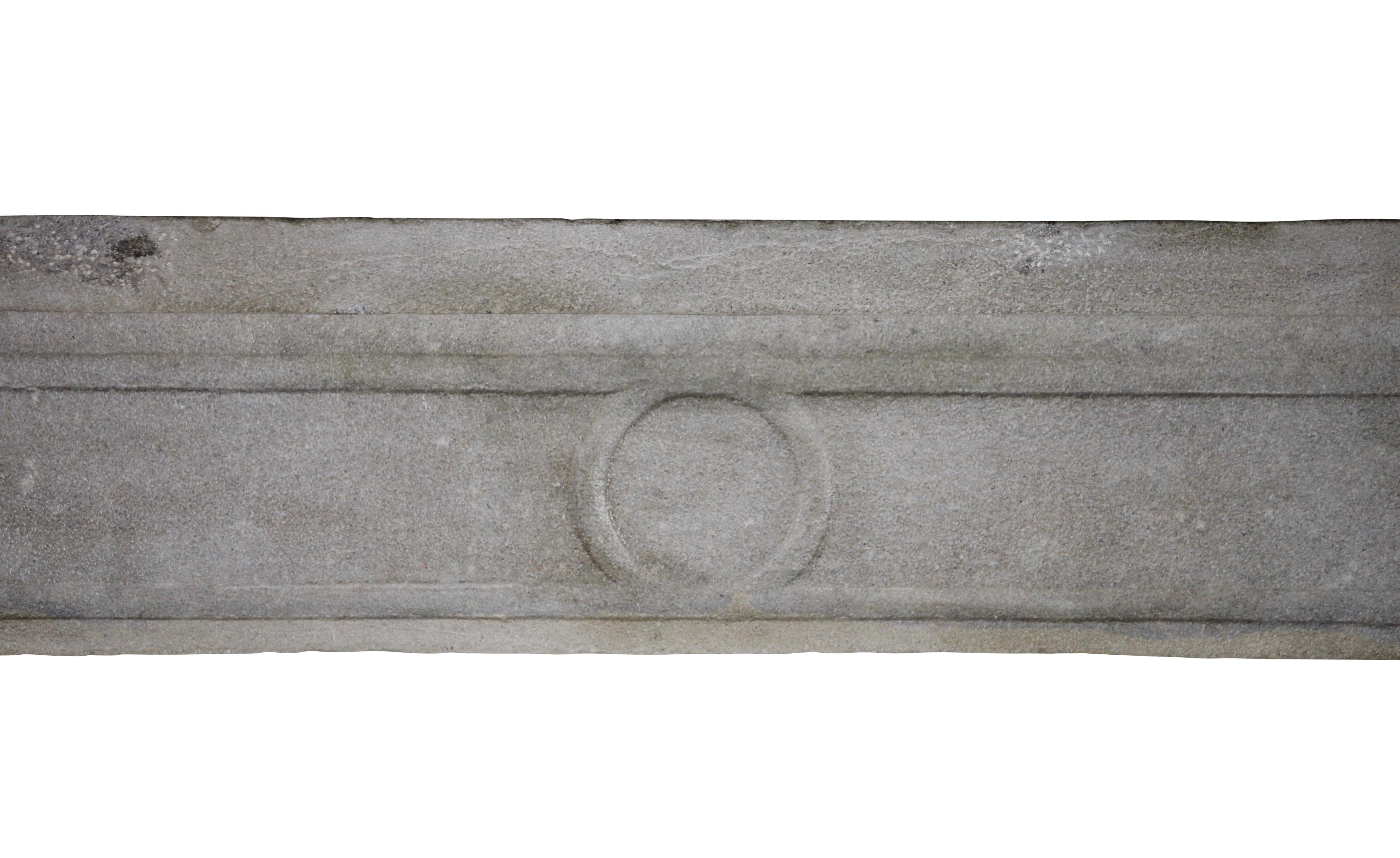 This French country fireplace surround is from the Louis XVI period in a bicolor limestone. The hand-carved piece and the polished surface is a great feeling.
The detail of the carving is fine. A mantel from a Provence bastille.

Measures;
162 cm EW