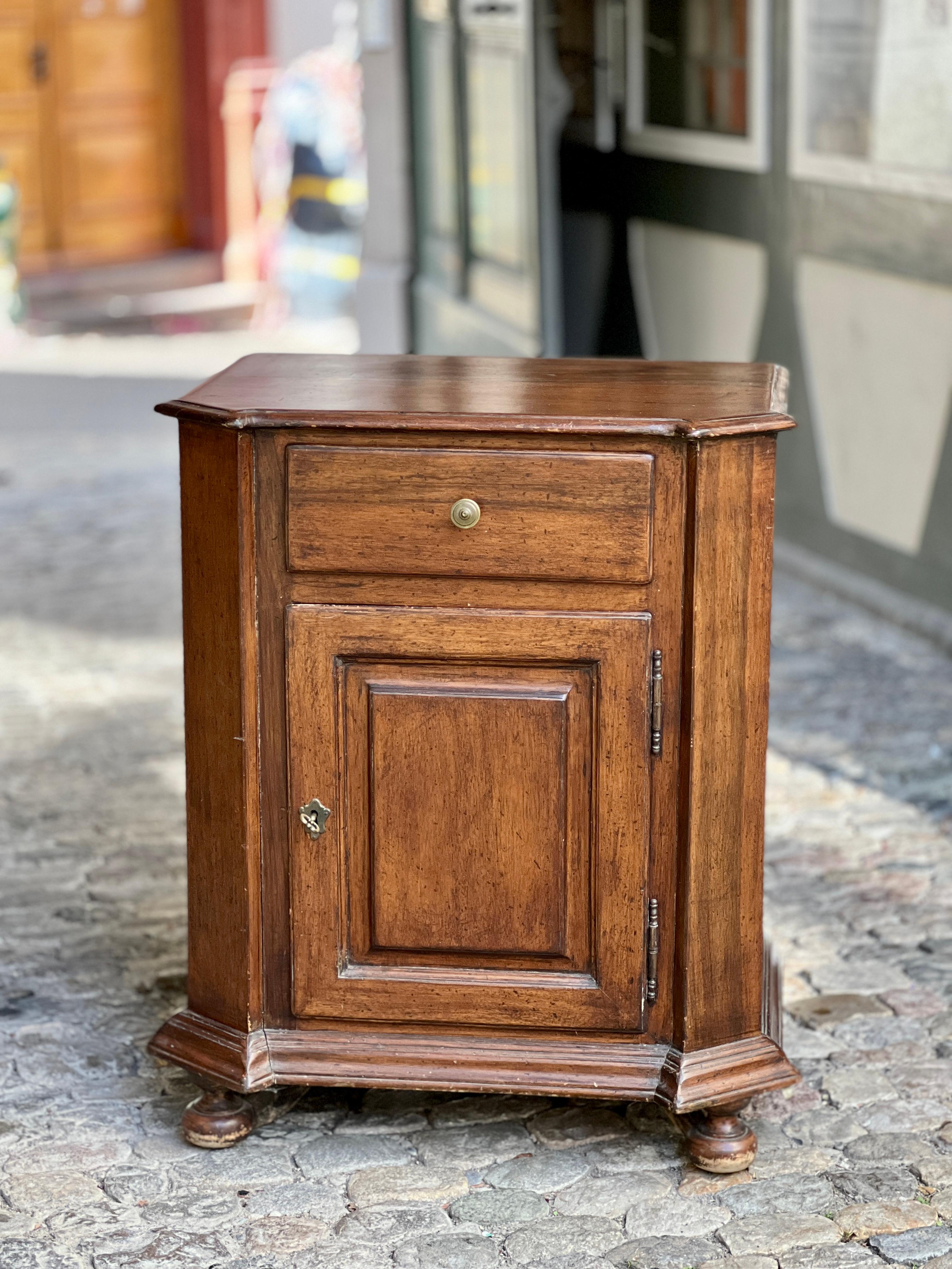 Neat very well made and functional small late 18th century sideboard / cupboard from France. Made in oak, with one drawer and a comparment with two shelves behind the door underneath. Rustic, but elegant. Good measures makes it easy to place in. The