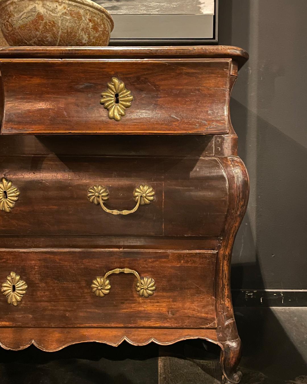 Step into the lavish embrace of the 18th century with this exquisite French solid walnut dresser. This opulent piece, a testament to the grandeur of French design, boasts a meticulous construction in rich, solid walnut. Adorned with four drawers,