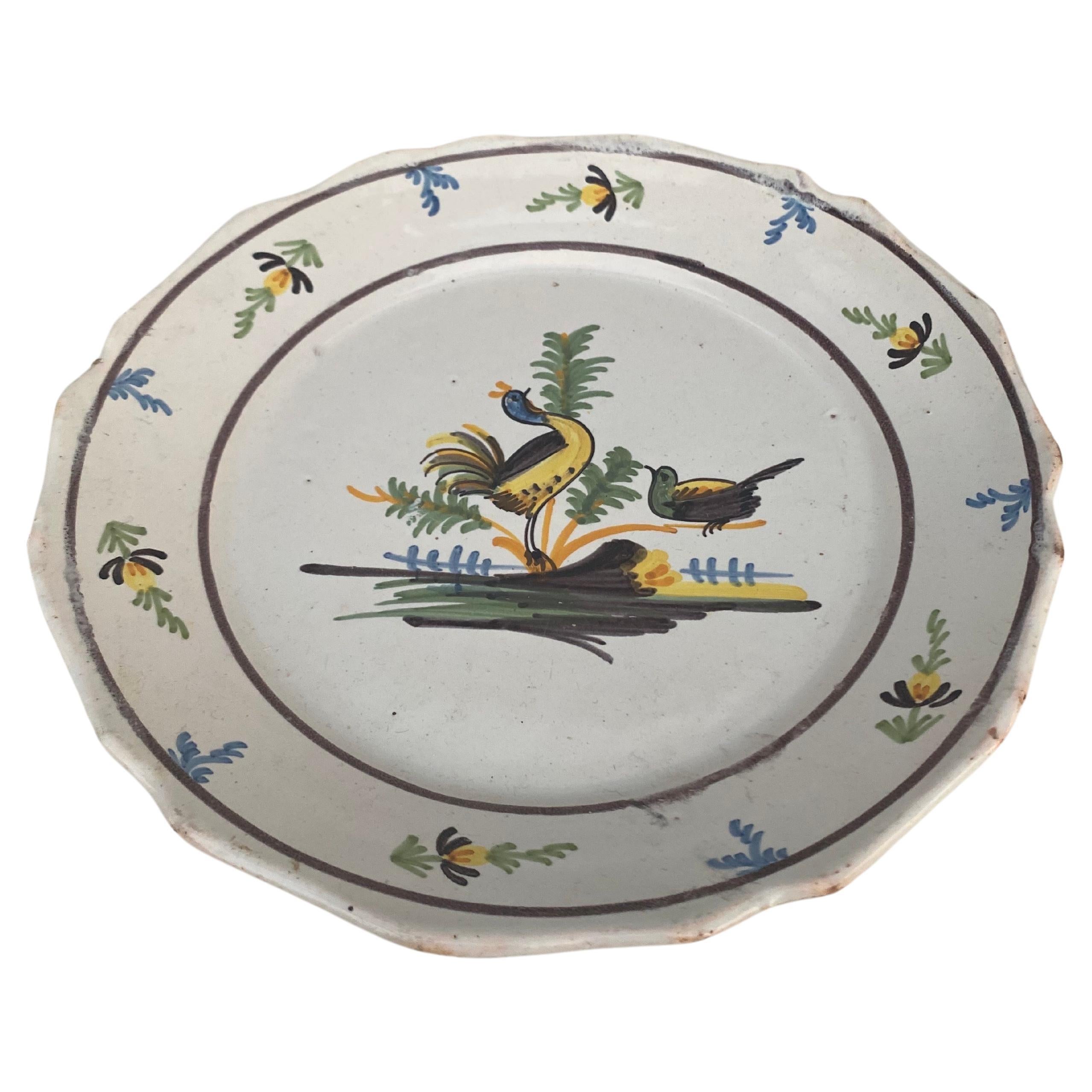 18th Century French faience Nevers plate.
2 birds on the center with a flowers border.