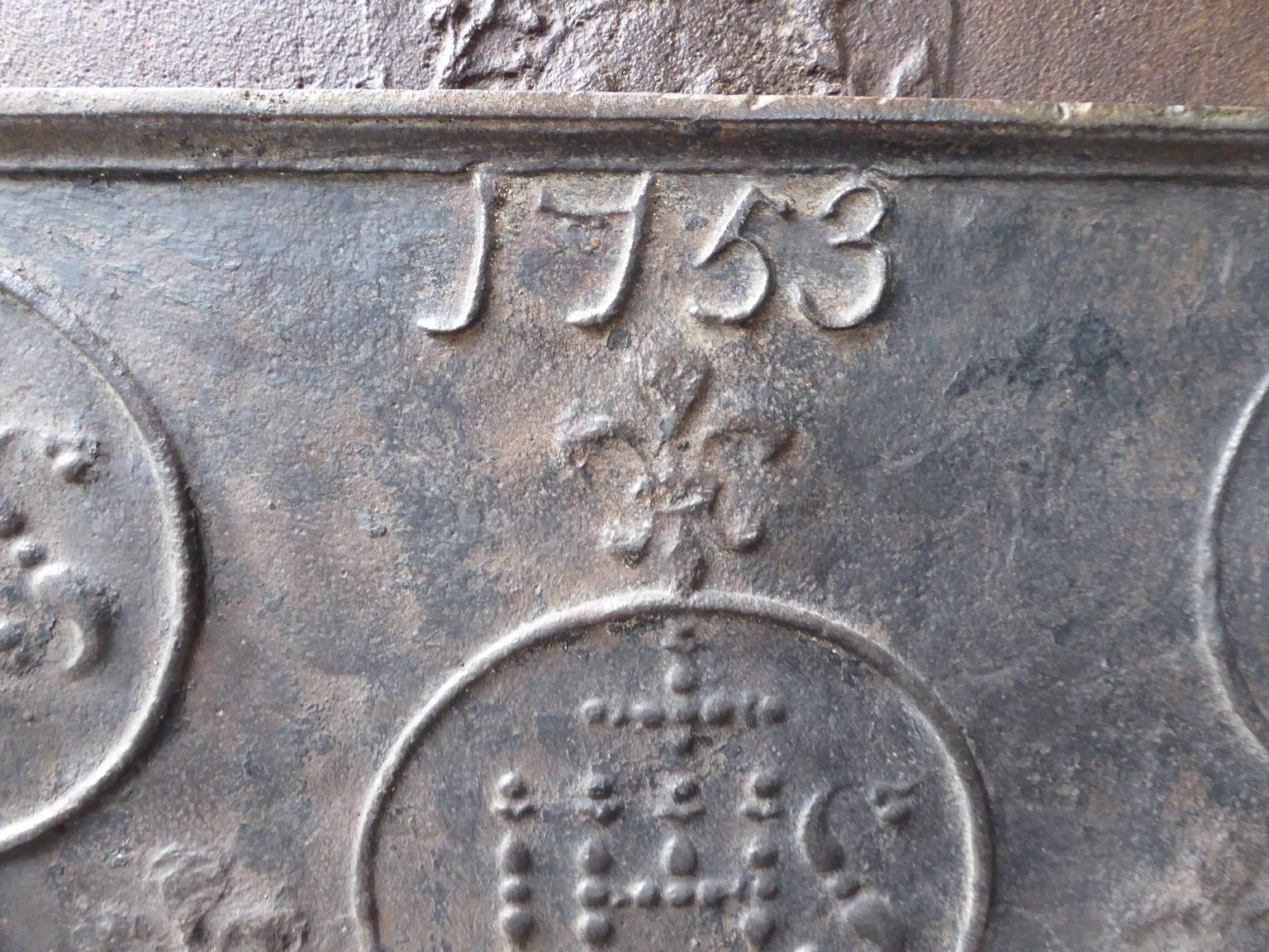 18th century Louis XV French fireback with pillars, three IHS monograms, and the date of production 1753.

The monogram IHS stands for Iesus Hominum Salvator (Jesus the Savior of Humanity) or In Hoc Signo (In this sign will you win). The pillars