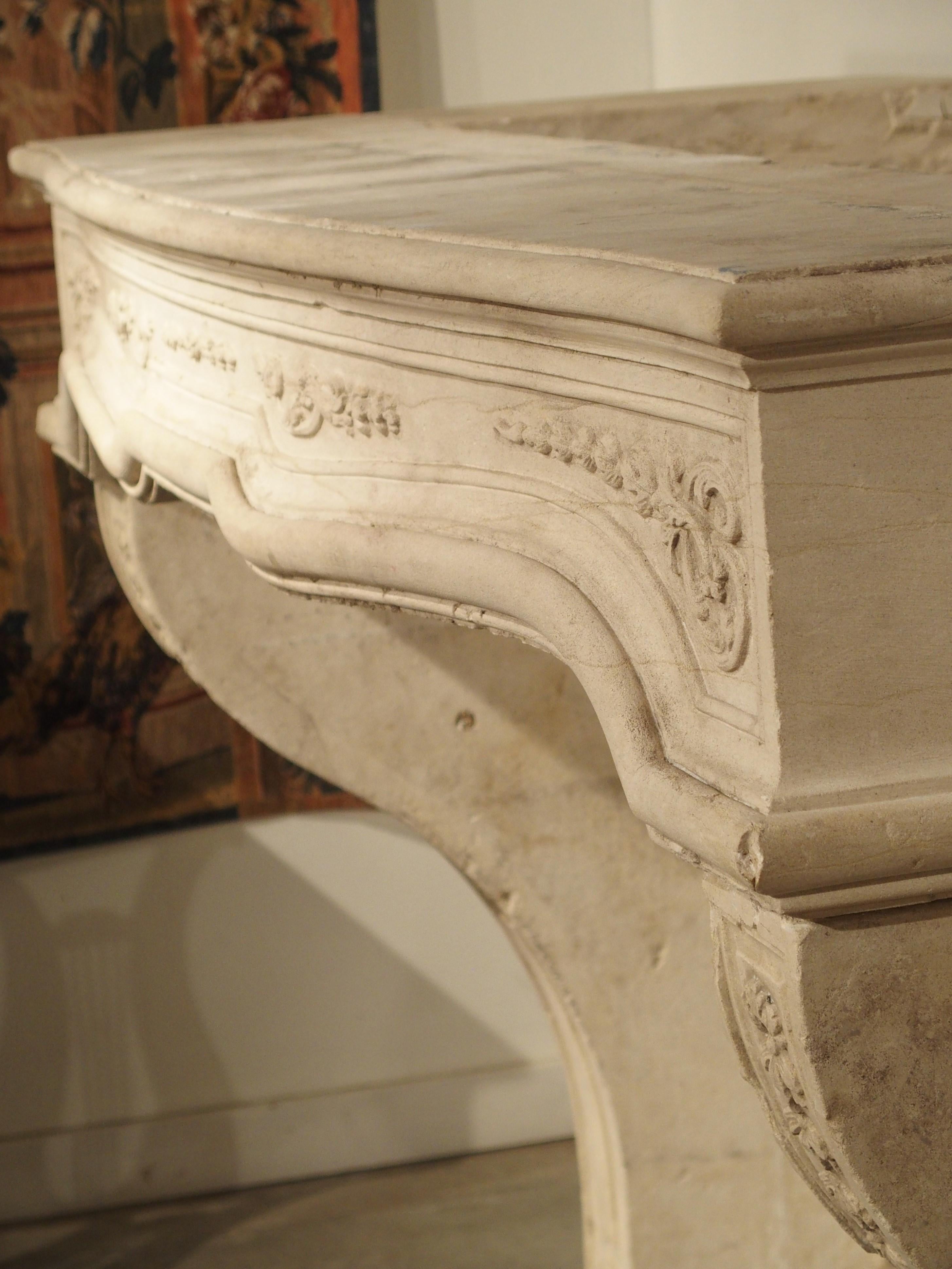 18th Century French Fireplace Mantel in Carved Limestone For Sale 8