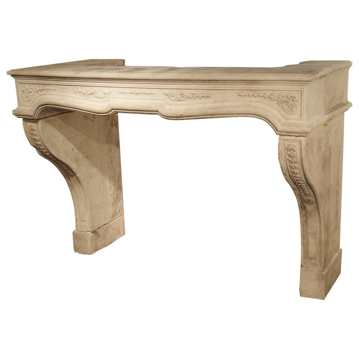 18th Century French Fireplace Mantel in Carved Limestone