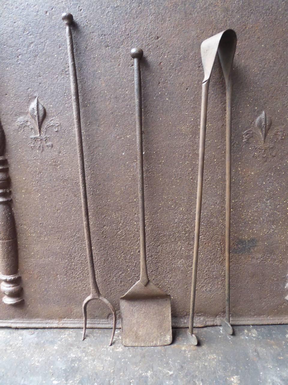 18th century French fireplace tool set made of wrought iron.

We have a unique and specialized collection of antique and used fireplace accessories consisting of more than 1000 listings at 1stdibs. Amongst others, we always have 300+ firebacks, 250+