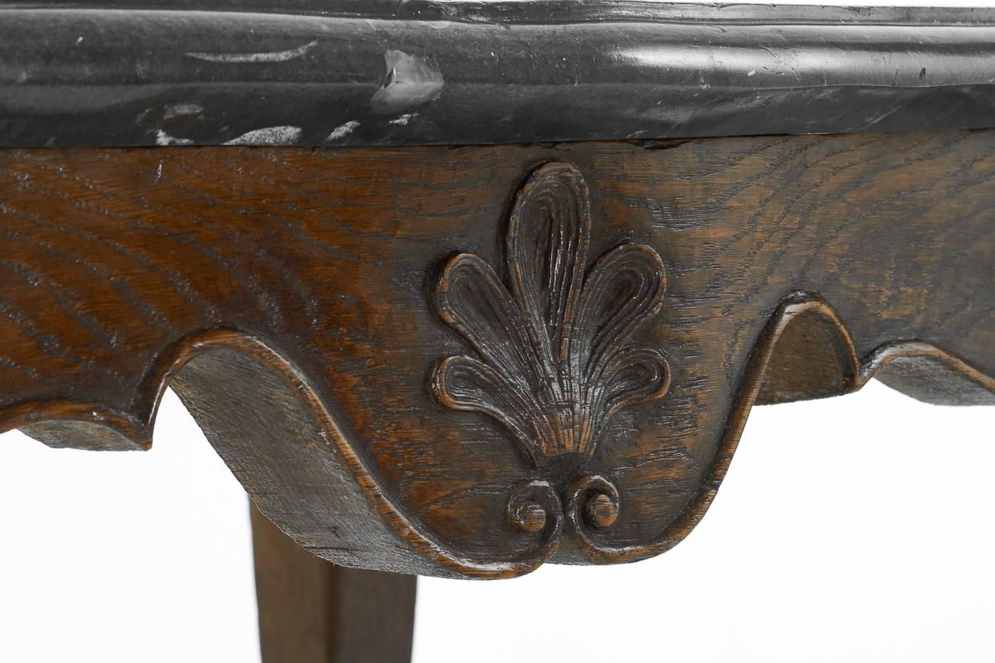 Stunning Louis XV period carved oak console table with, 40mm thick, original fossil marble-top, circa 1760.

We carefully oversee all aspects of restoration of our items, working with our special team of craftsmen on each piece from start to