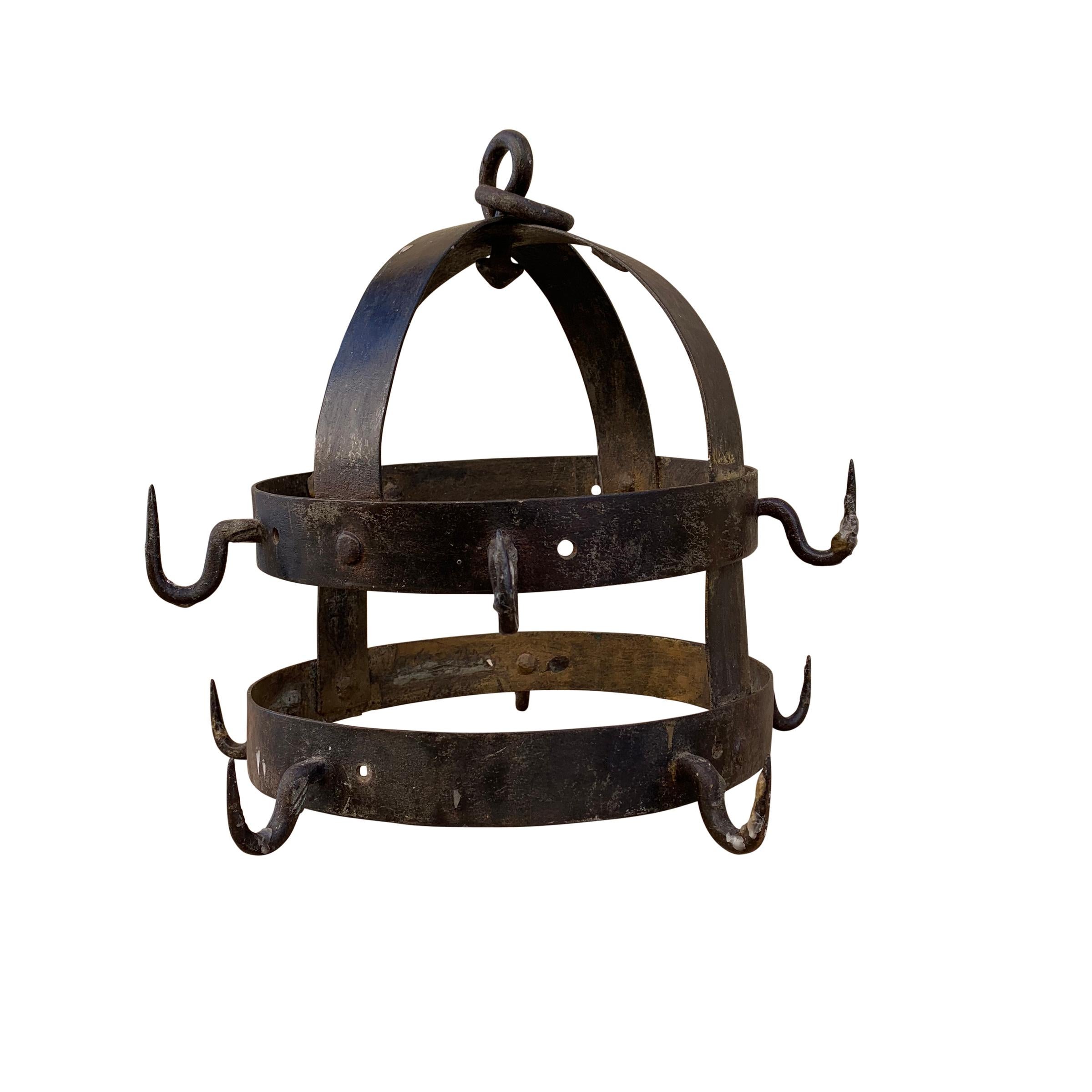 A beautiful 18th century French handwrought iron game rack with two outer rings with ten hooks. Game racks were used to age pheasants, rabbits, or any other small game, after the hunt. This would make the most perfect pot rack in small kitchen, or