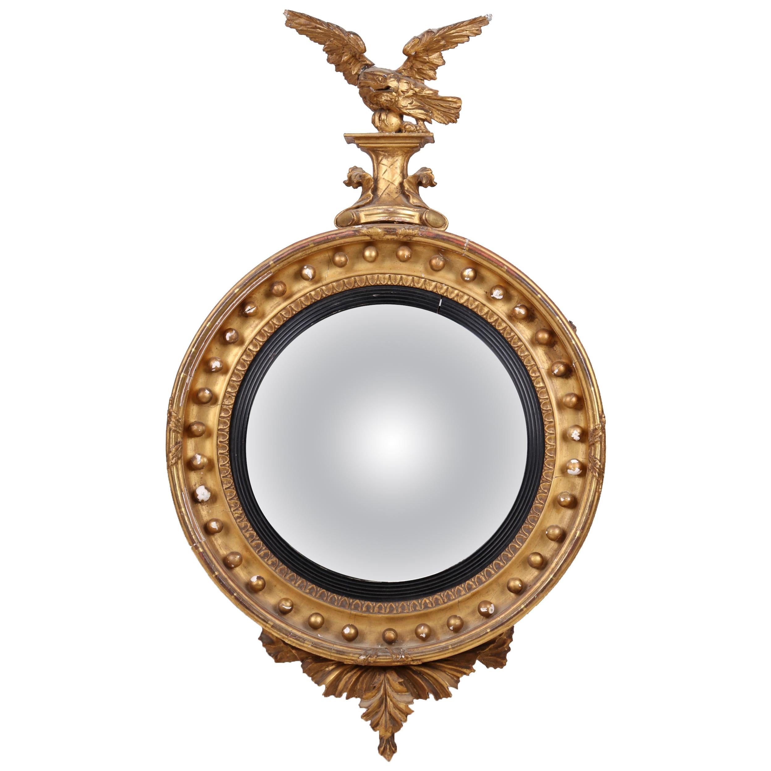 18th Century French Golden Regency Convex Mirror Topped by an Eagle For Sale