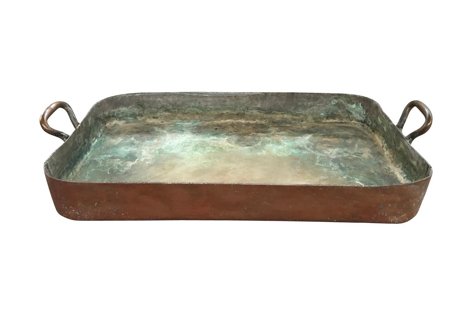 A wonderful 18th century grand scale pan in heavy gauge copper and brass handles from the South of France. Perfect as a center piece on a farm table or displayed on a kitchen island.