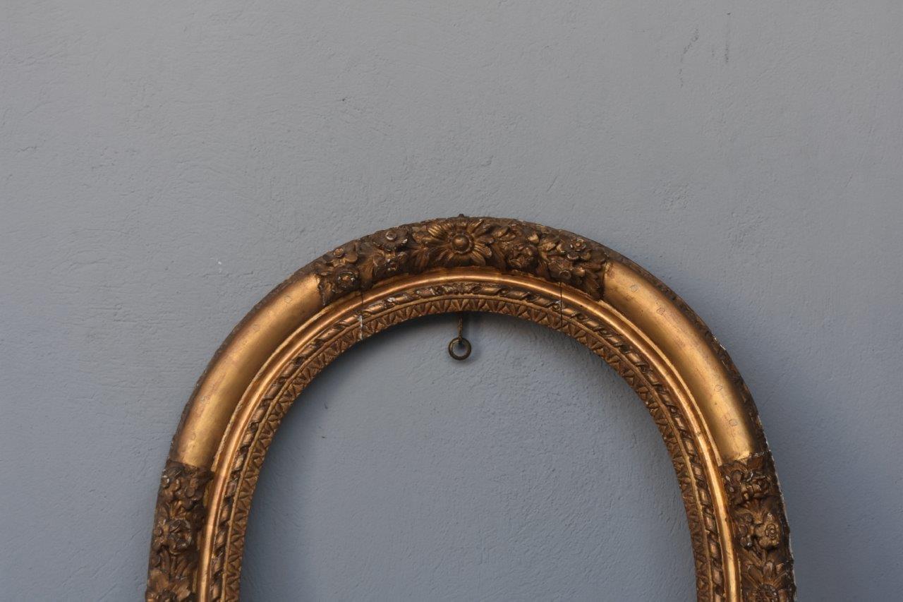 This beautiful 18th century French giltwood frame is richly inlaid and hand-carved with floral patterns. The gilding is made of gold leaves and it has its beautiful original patina and a rich shiny color. The frame is in very good condition. It can