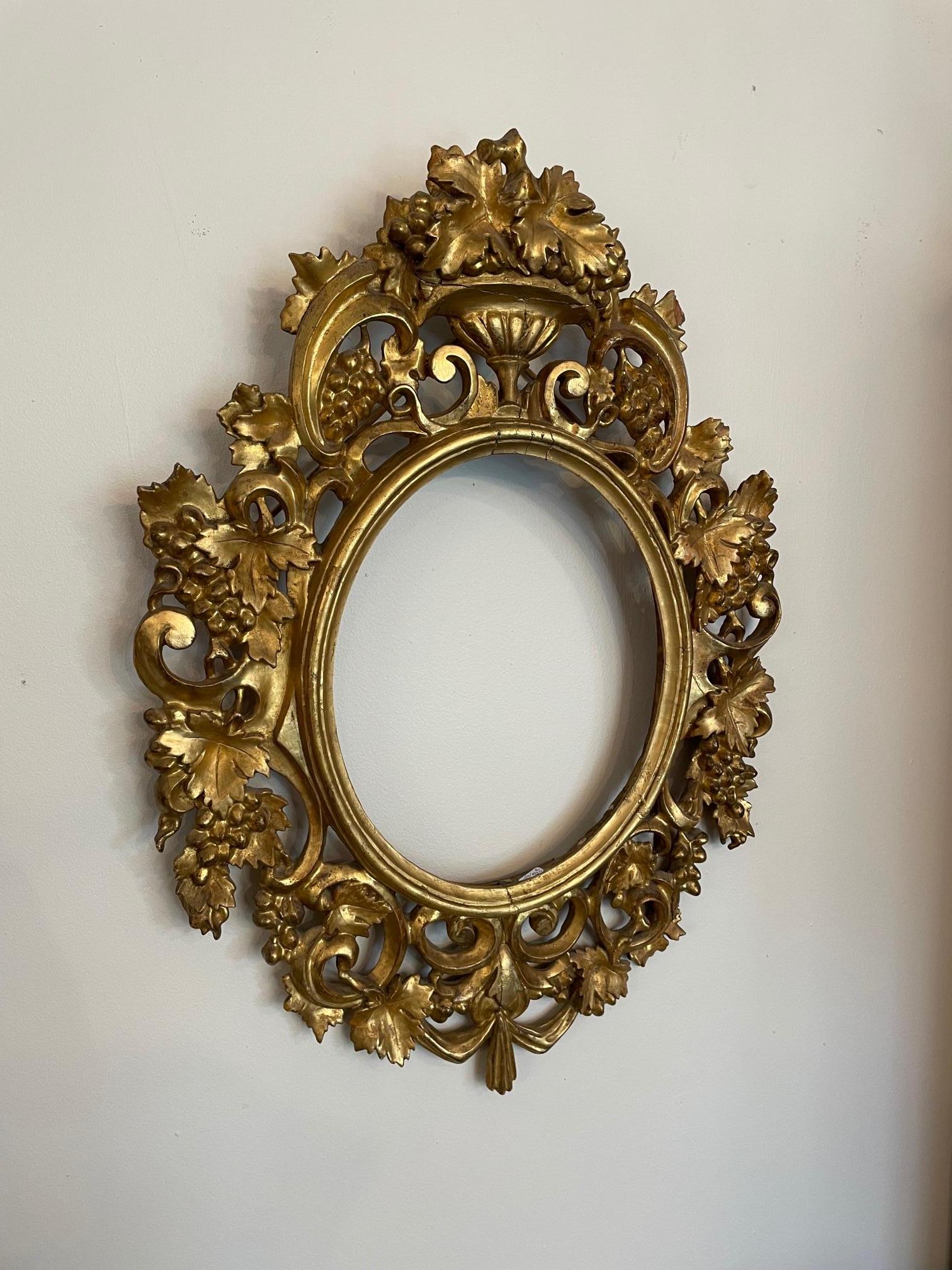 Beautiful 18th century French hand carved golden wood frame with grapes decor. 
Between Louis XV and Louis XVI style. 
Very nice quality and condition.
