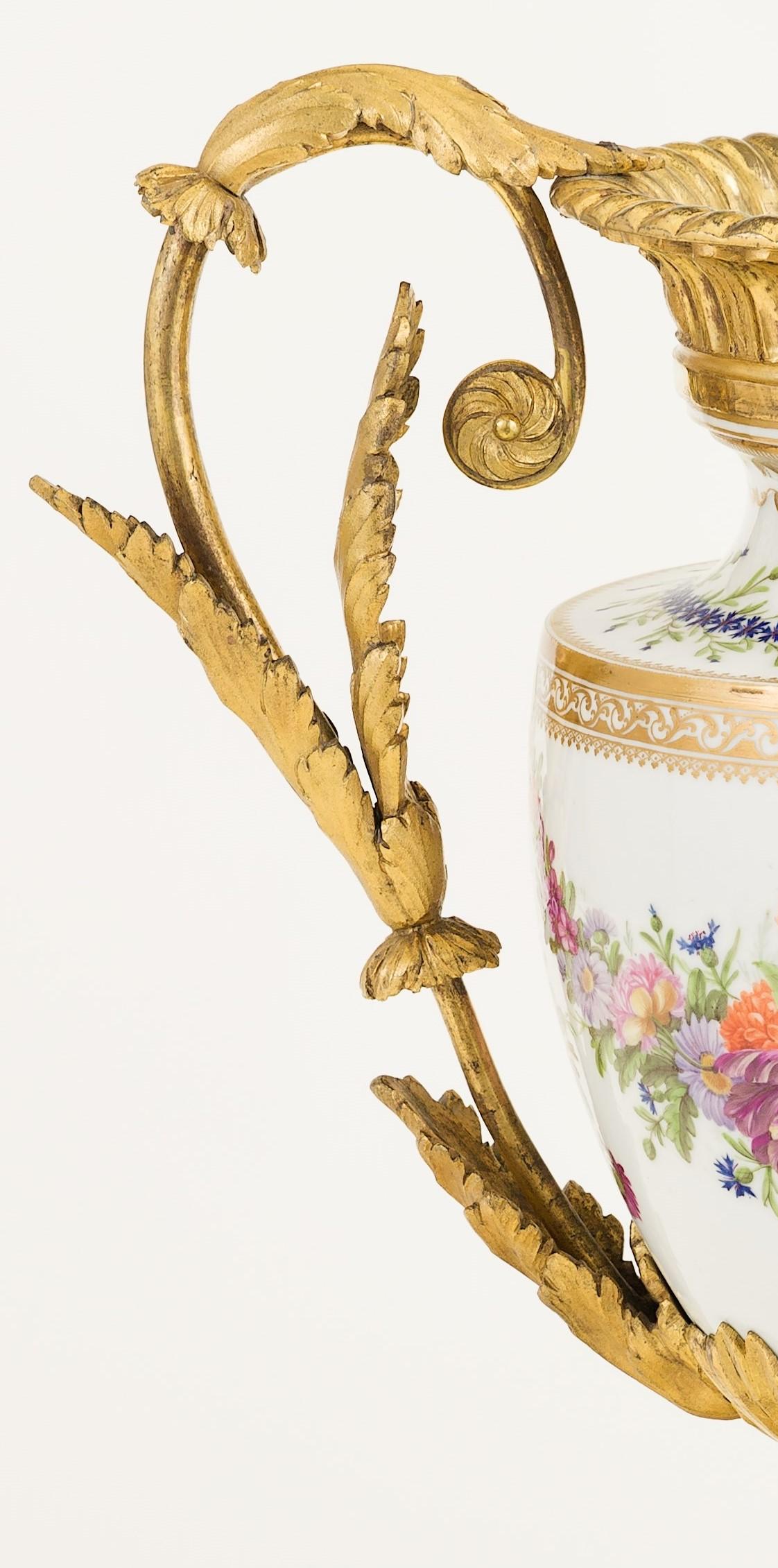 Transitional period, late 18th century (circa 1770-1780)
This vase embodies a neoclassical shape and a Rococo depiction of flowers, the blue flowers around the neck of the vase first appeared circa 1770s and became popular during the neoclassical